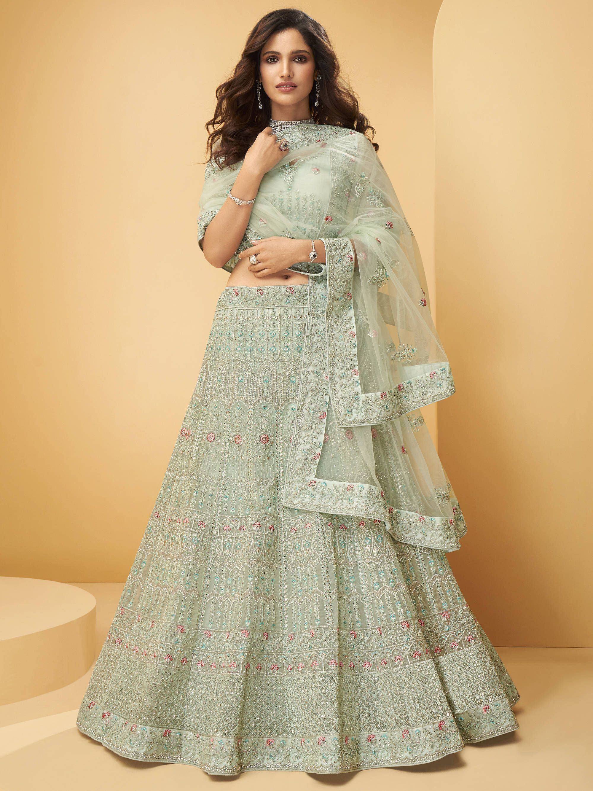 Mint green embroidered lehenga choli with floral motifs and sheer dupatta, perfect for Indian ethnic occasions.