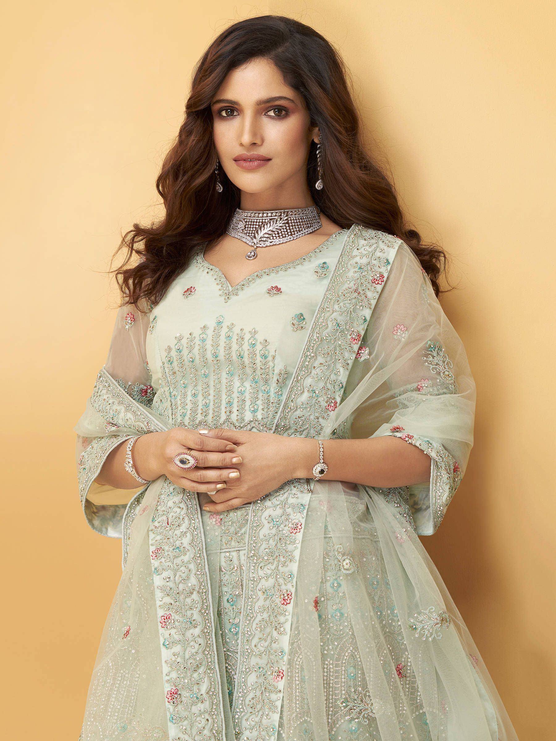 Elegant mint green embroidered ethnic gown with floral detailing and sheer dupatta