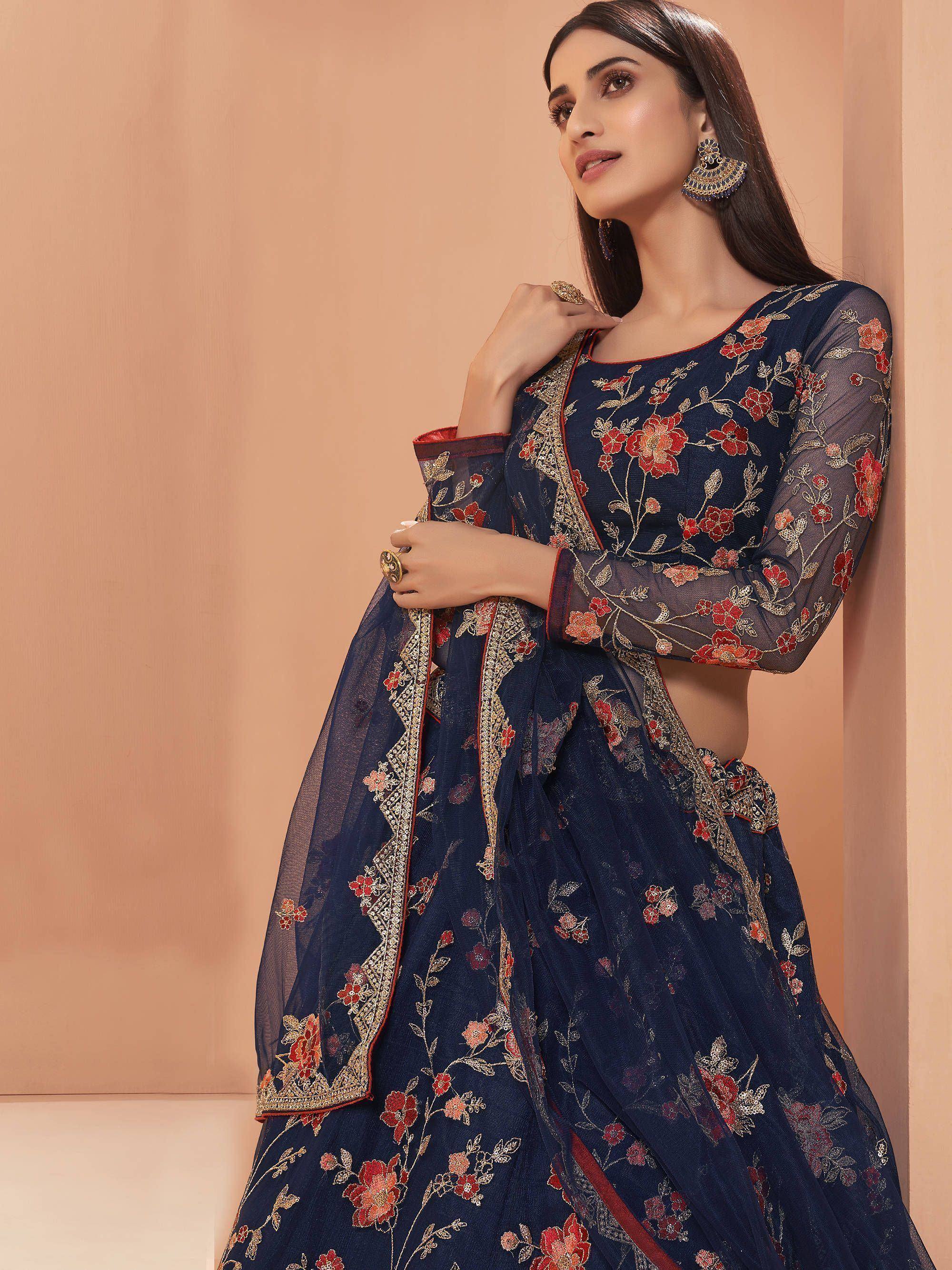 Navy blue floral embroidered lehenga choli with sheer sleeves and gold detailing, perfect for Indian ethnic wear.