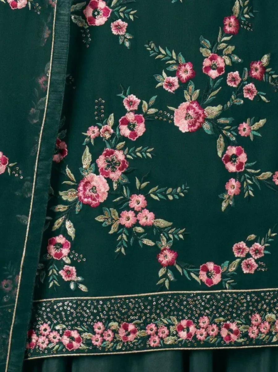 Dark green ethnic fabric with pink floral embroidery and sequin border detail