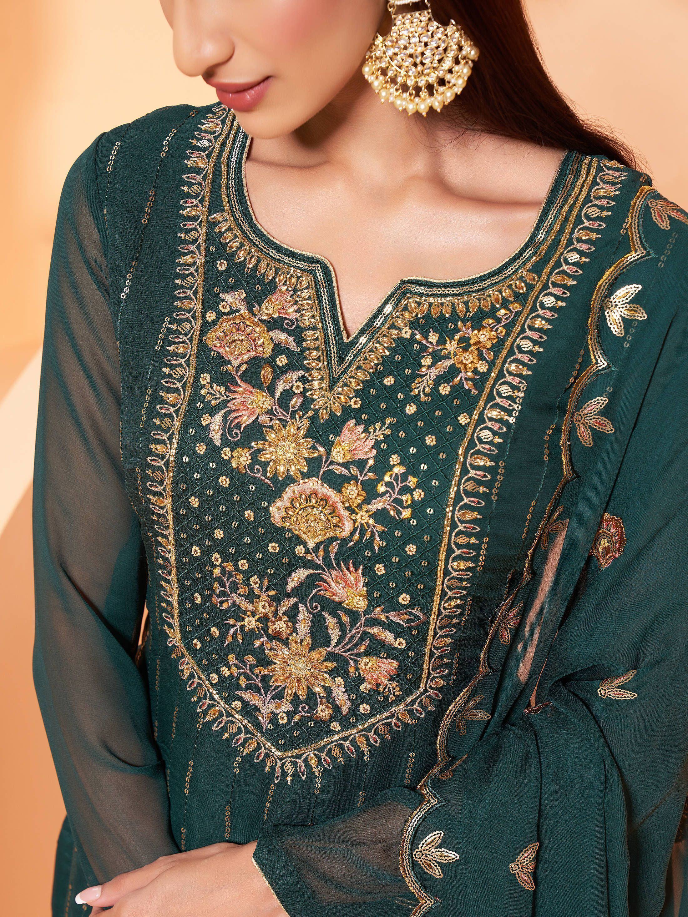 Emerald green embroidered salwar kameez with floral gold threadwork and sheer sleeves