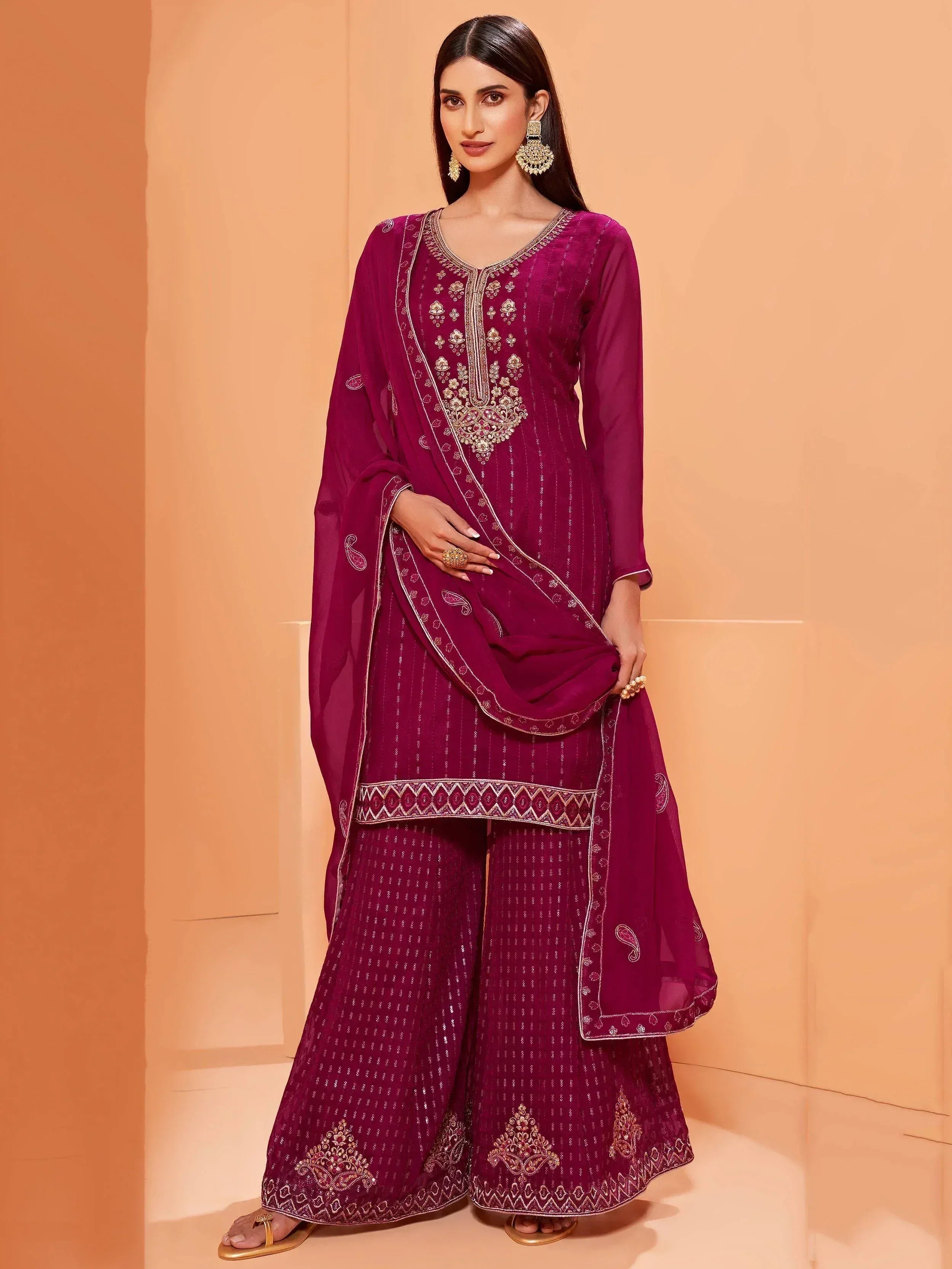 Elegant maroon salwar kameez with gold embroidery and matching dupatta, perfect for Indian ethnic occasions.