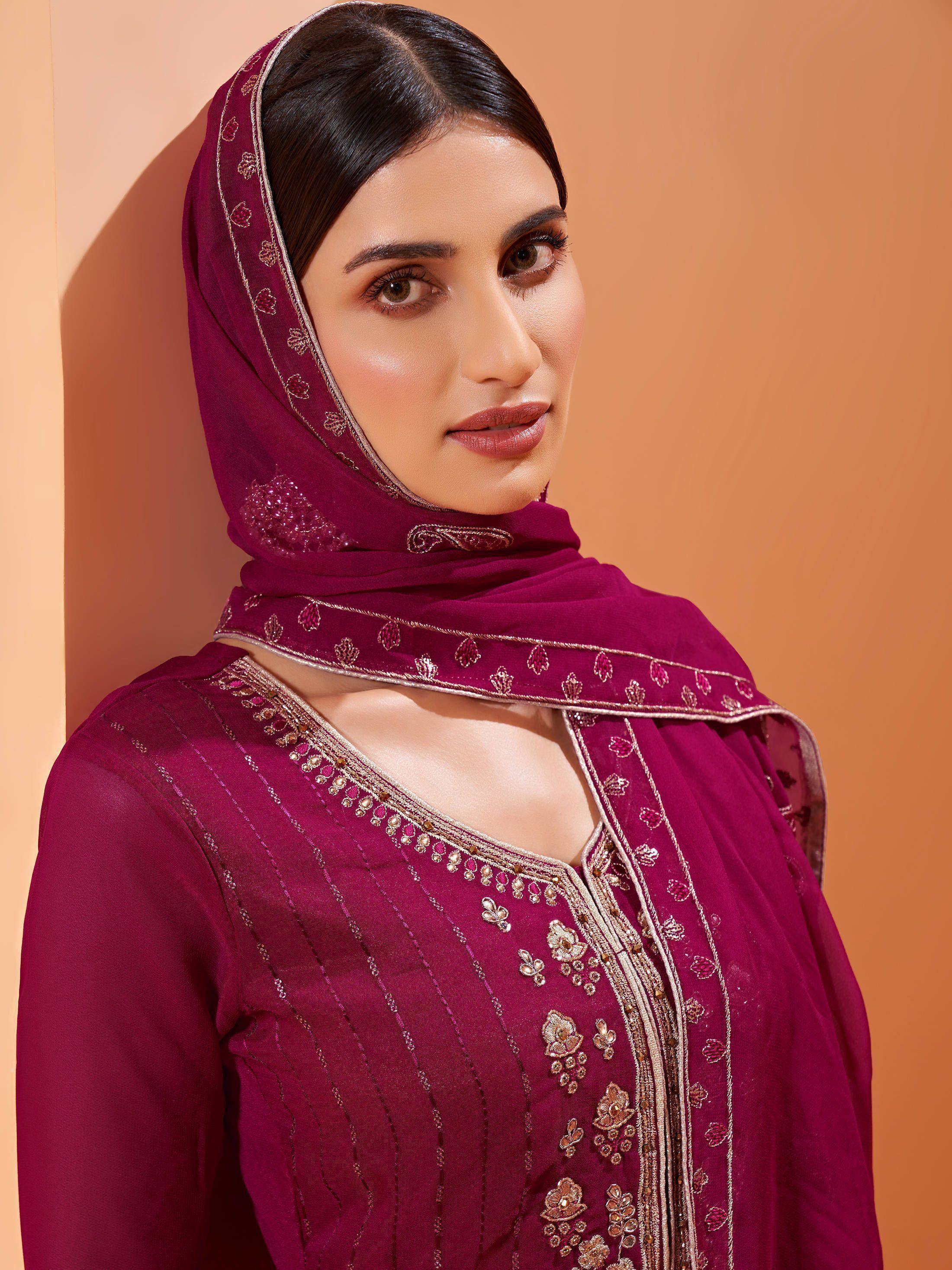 Elegant maroon salwar kameez with gold embroidery and matching dupatta, perfect for Indian ethnic wear