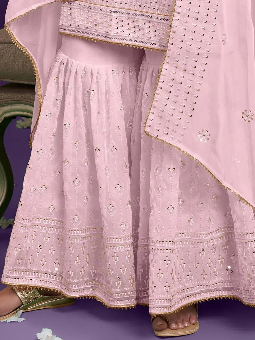 Pink embroidered lehenga choli with gold detailing, perfect for Indian ethnic wear occasions