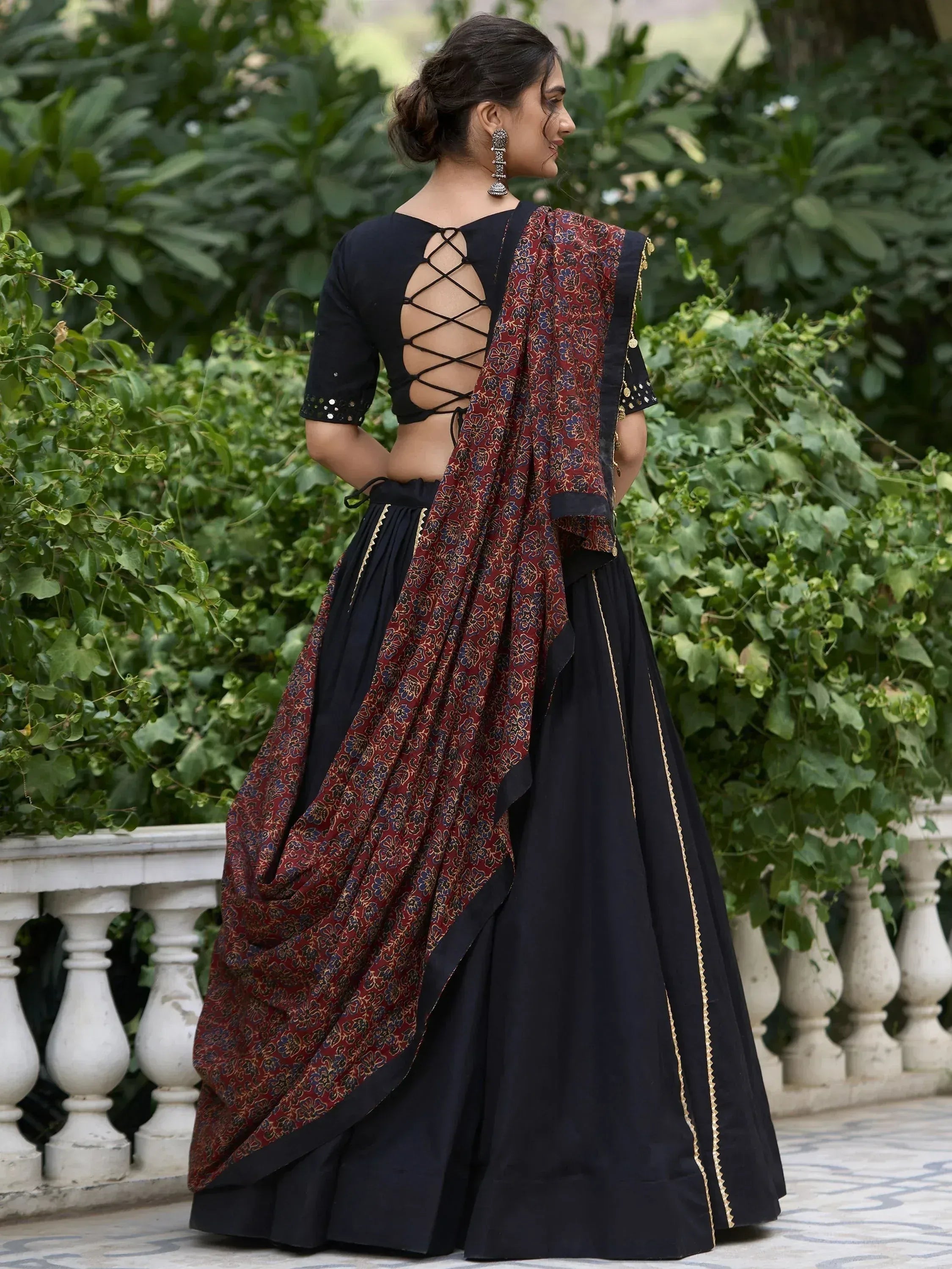 Black lehenga choli with floral dupatta, crisscross back blouse, gold trim, perfect for Indian ethnic occasions