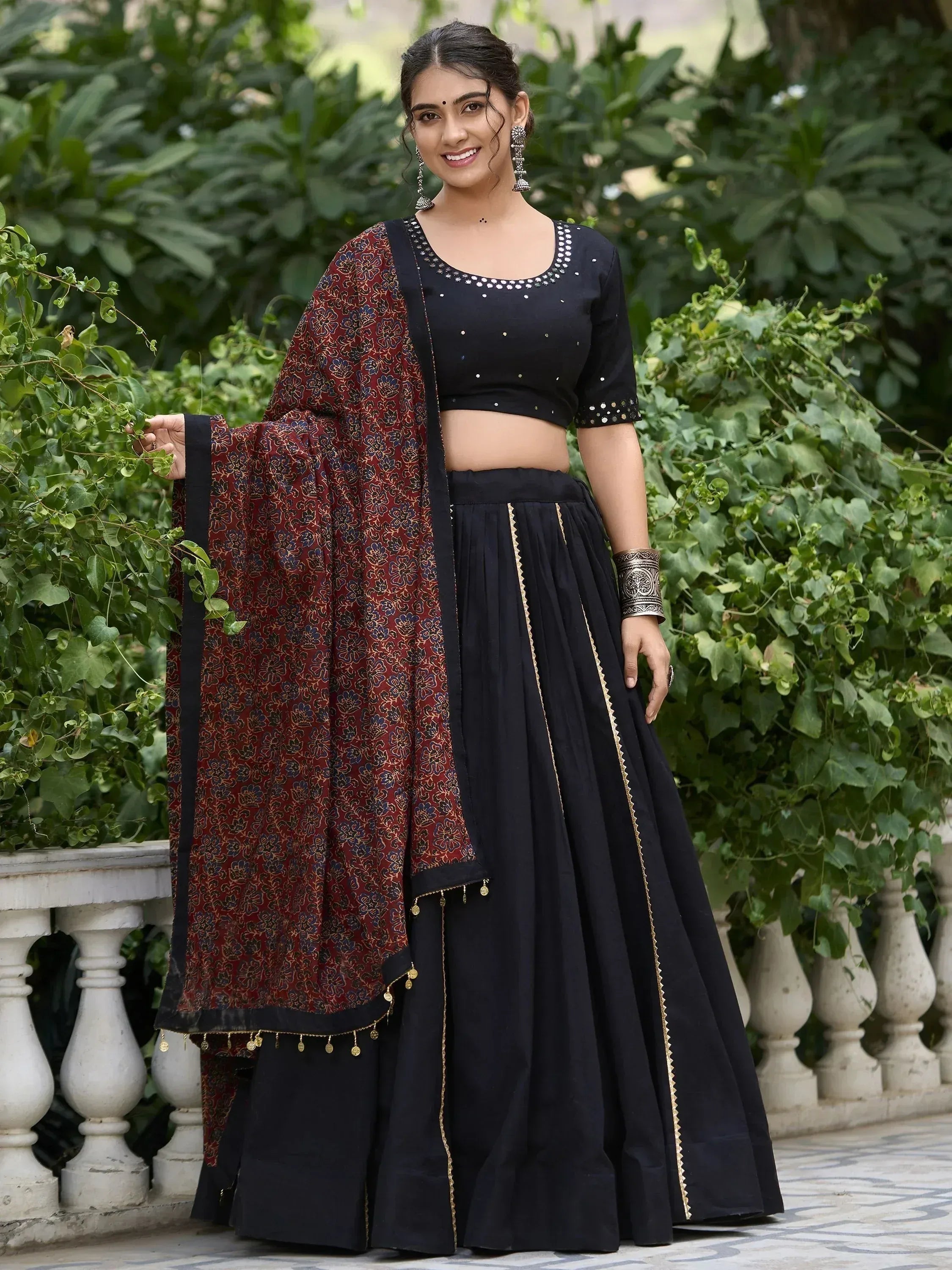 Black lehenga choli with maroon floral dupatta, perfect for Indian ethnic wear occasions.