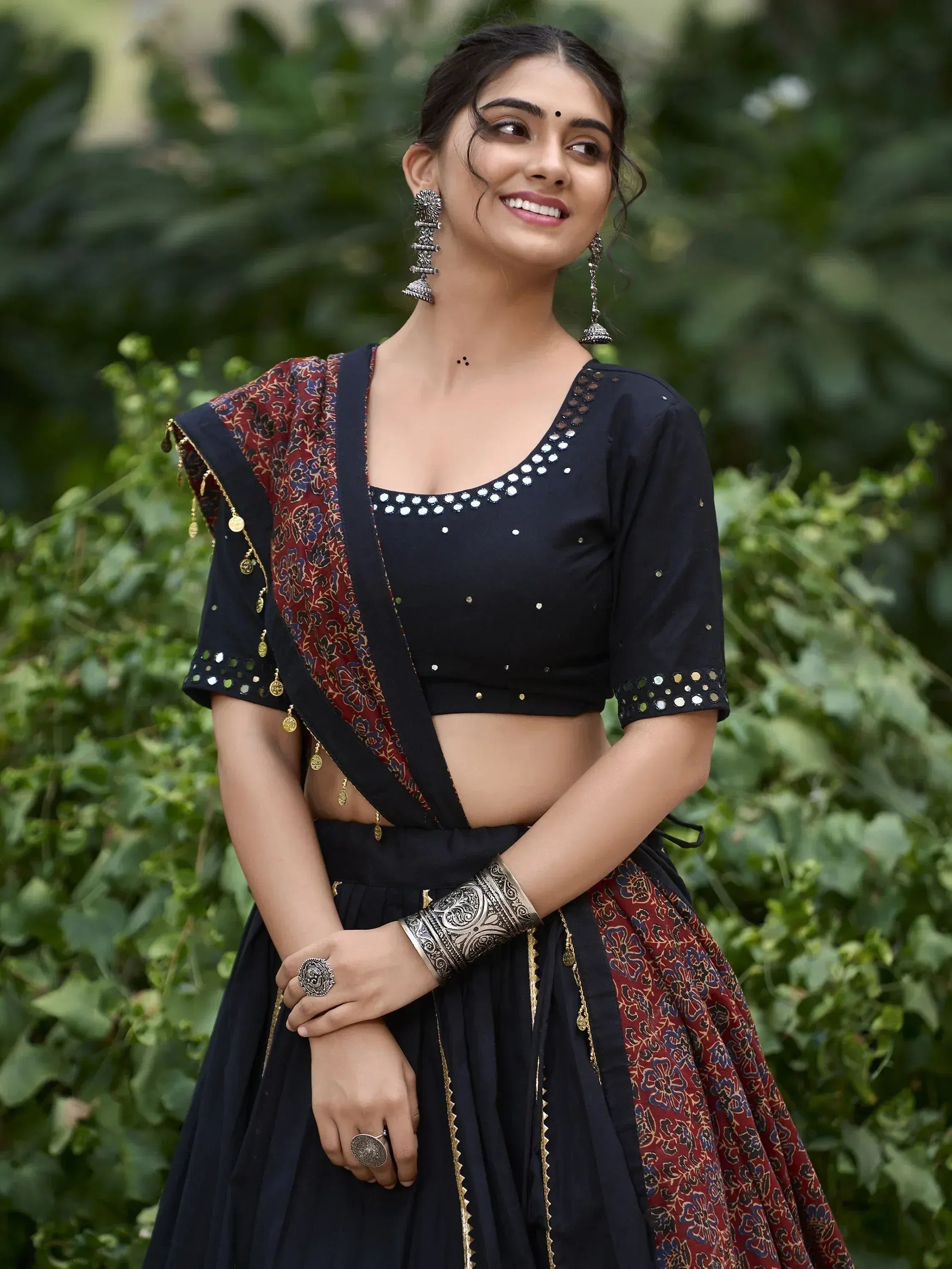Black and red floral lehenga choli with mirror work, perfect for Indian ethnic wear and festive occasions.