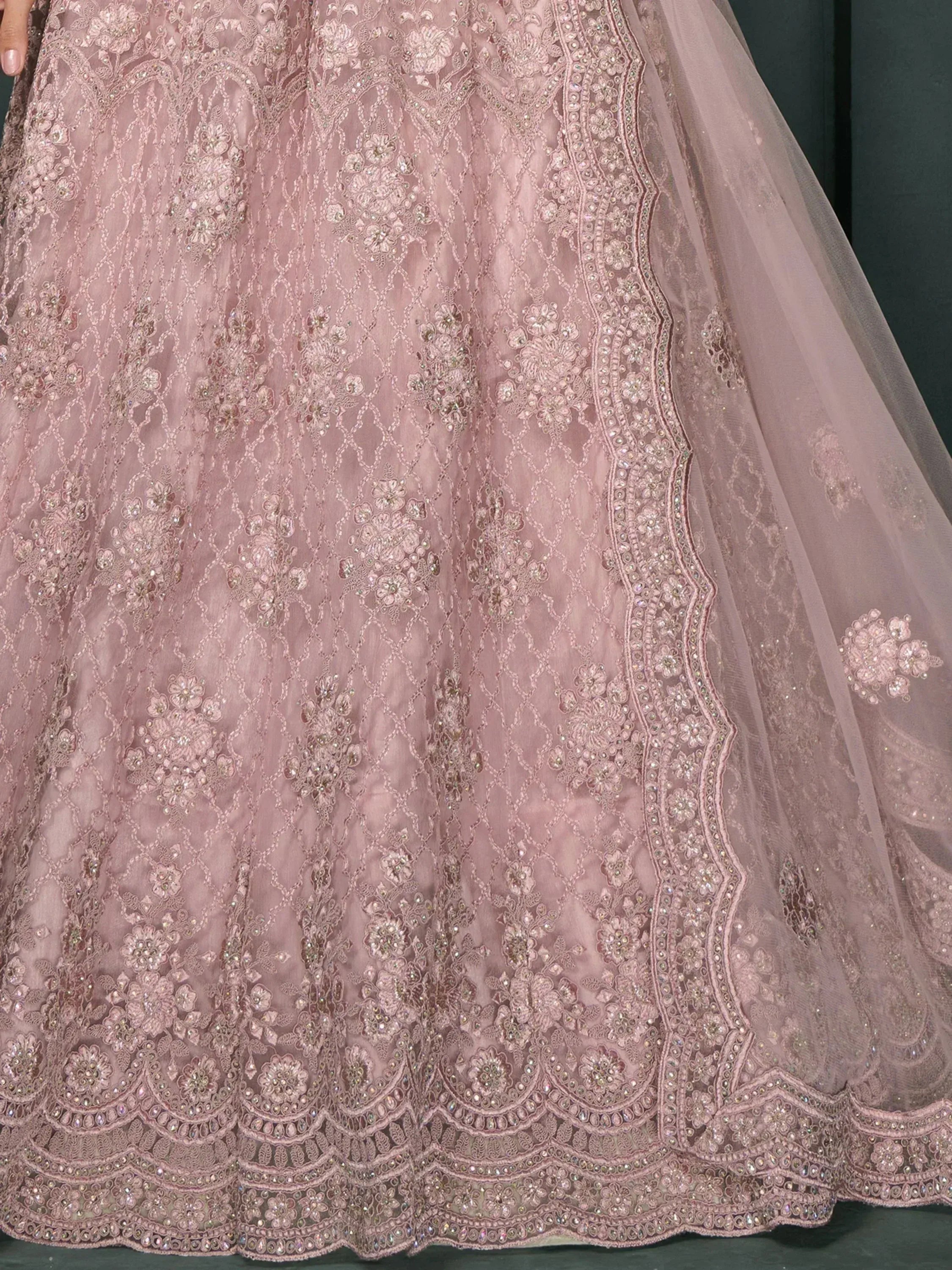 Dusty pink designer lehenga with intricate floral embroidery and sequin detailing for Indian ethnic wear