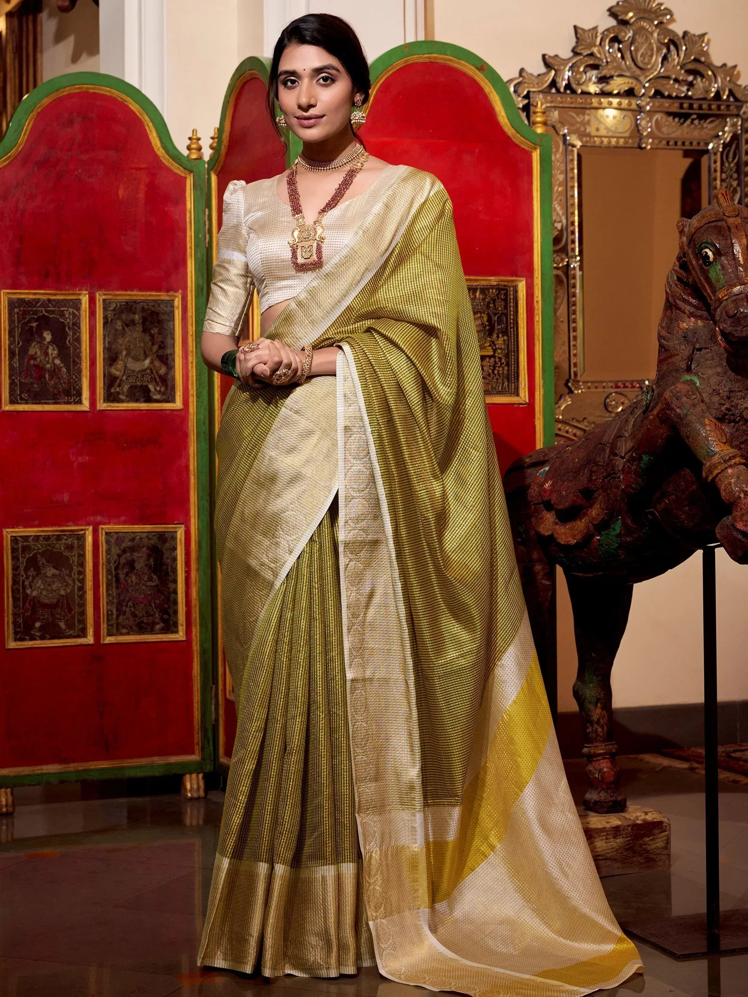 Elegant olive green and gold striped saree with white blouse, traditional Indian ethnic wear for women