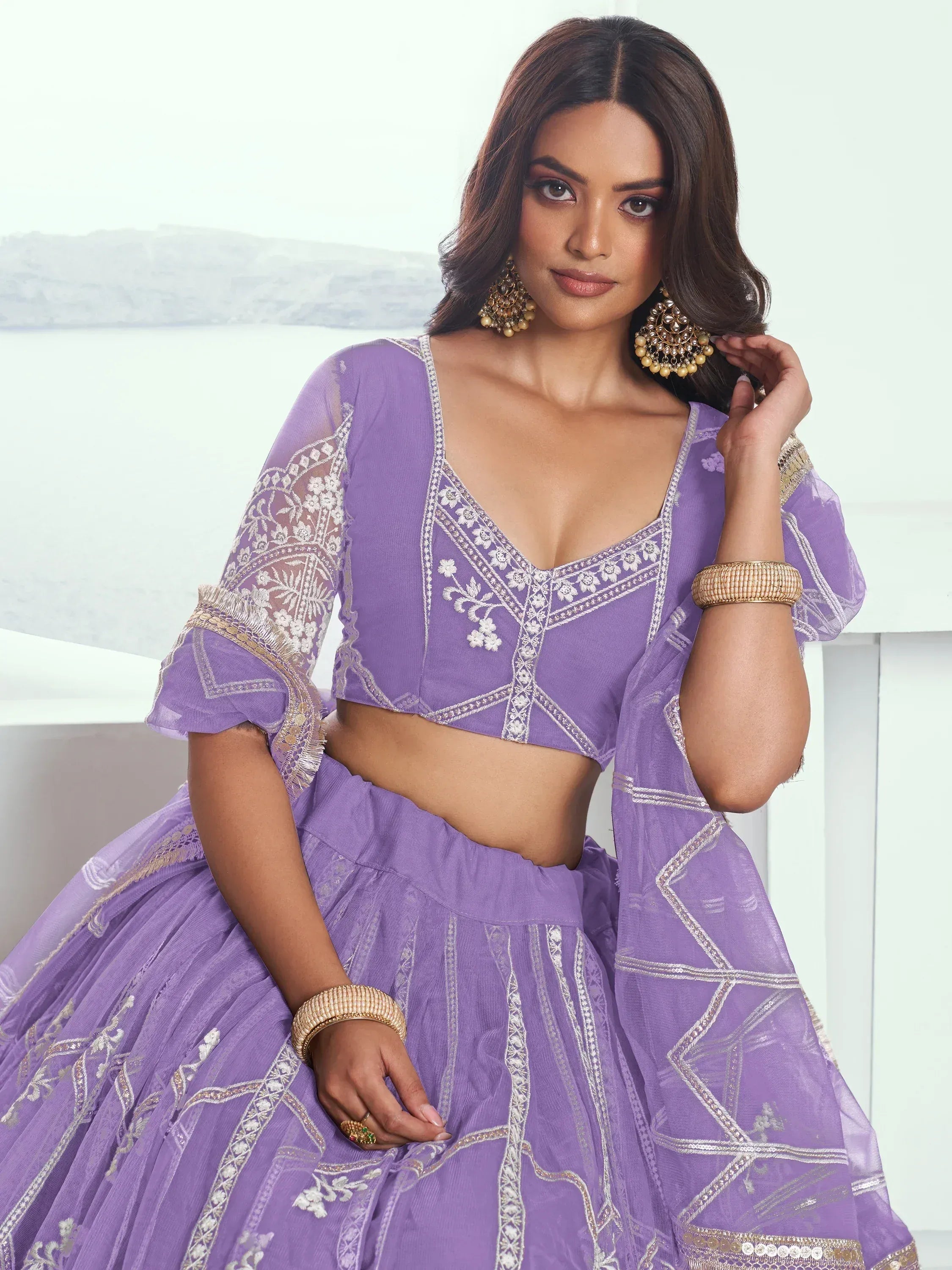 Purple embroidered lehenga choli with floral detailing, perfect for Indian ethnic wear and festive occasions.
