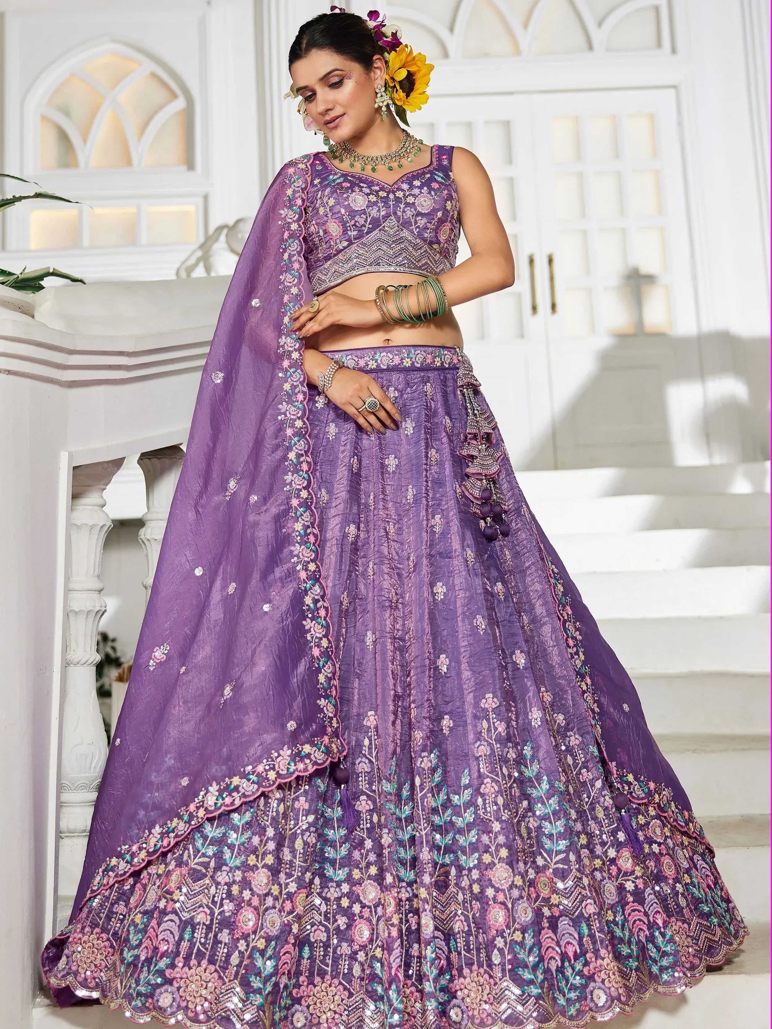 Purple embroidered lehenga choli with floral detailing, perfect for Indian ethnic wear and festive occasions.