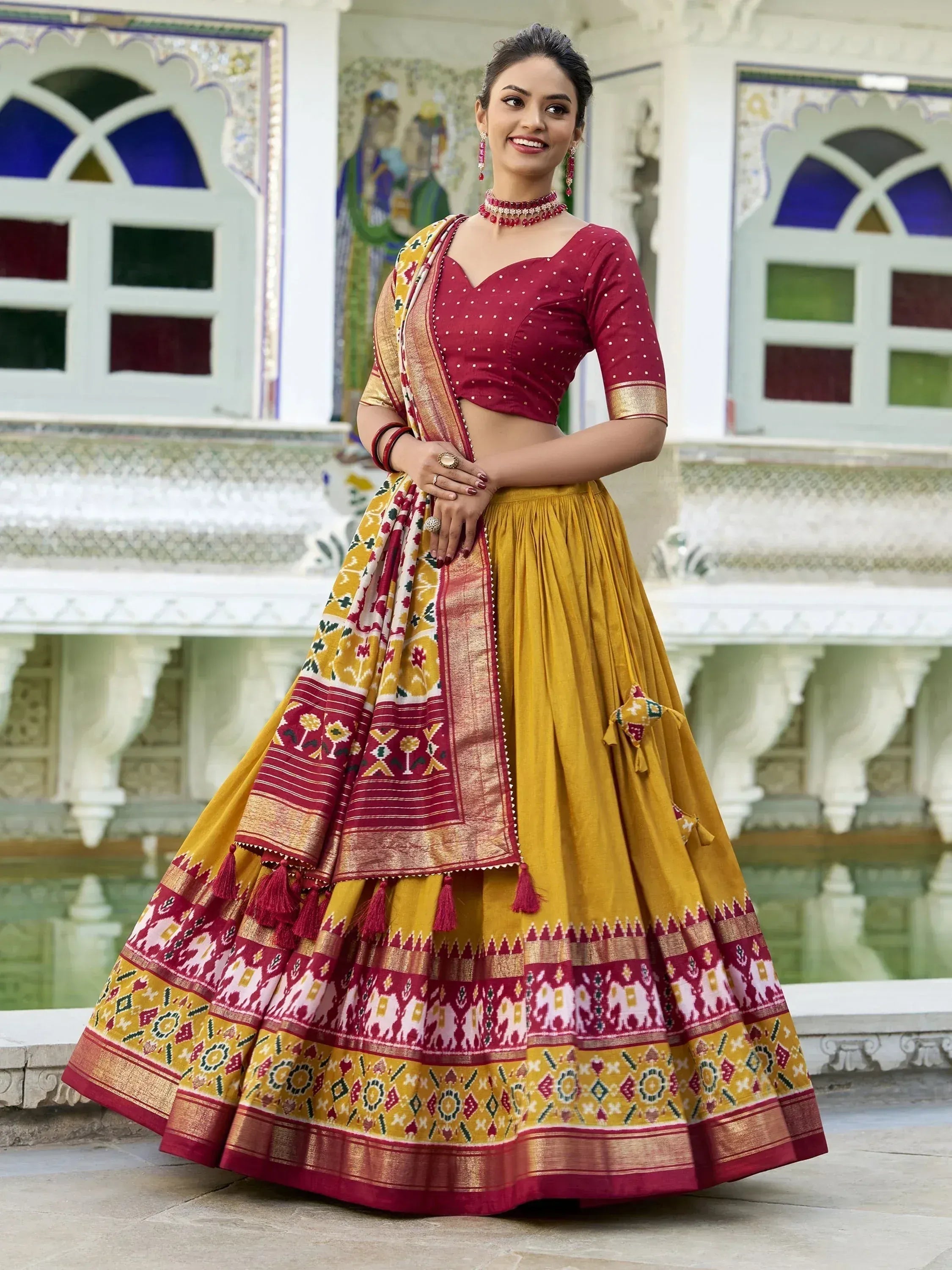 Maroon and mustard yellow designer lehenga choli with ethnic print, perfect for Indian weddings and festivals