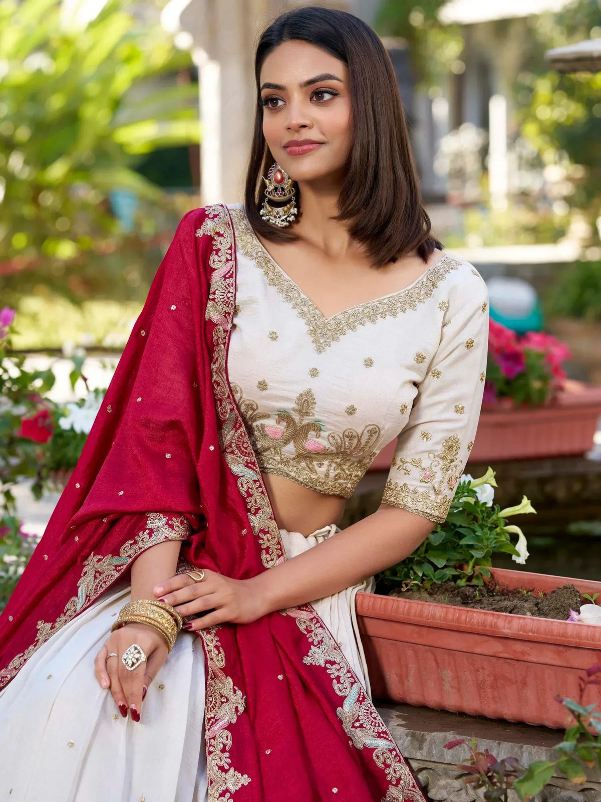 Elegant white and maroon lehenga choli with gold embroidery, perfect for Indian ethnic wear occasions