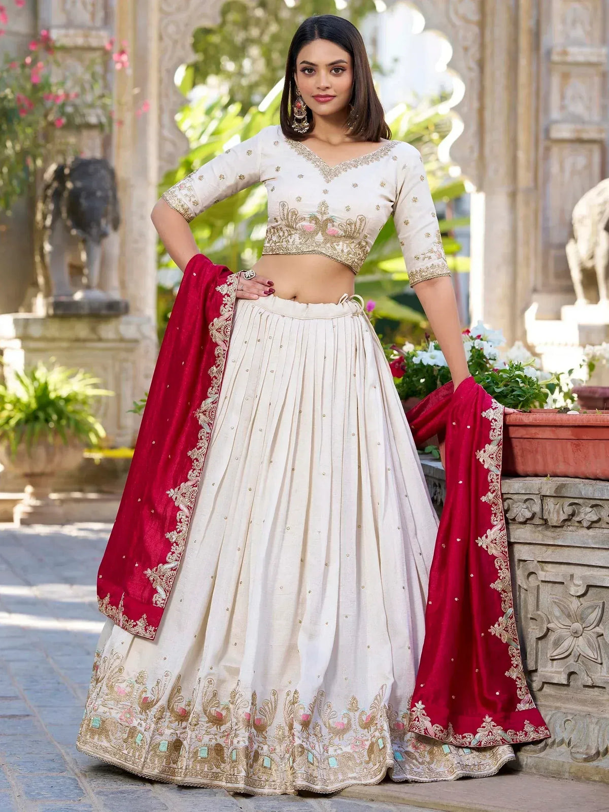 Cream embroidered lehenga choli with red dupatta, perfect for Indian weddings and festive occasions