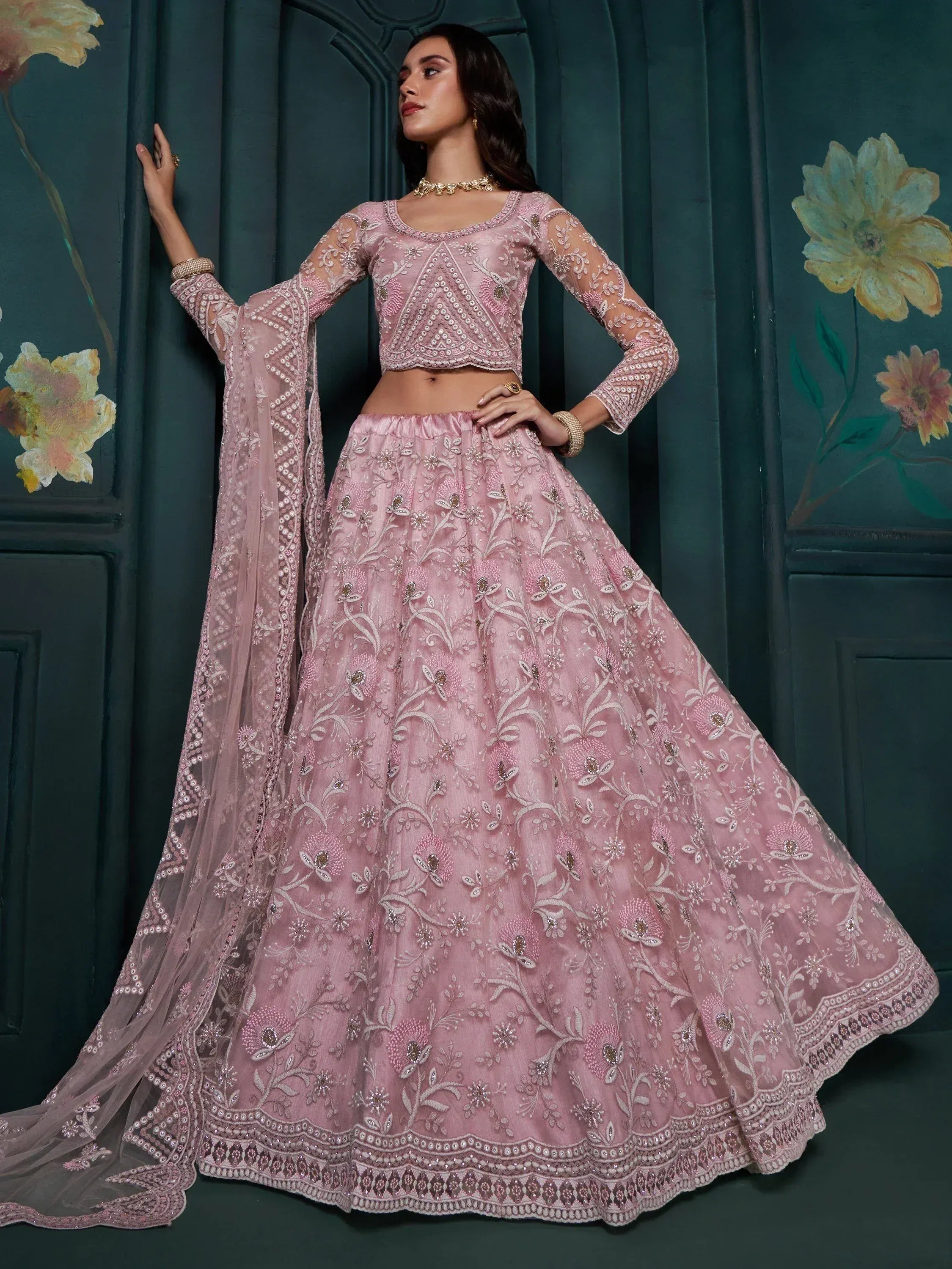 Pink embroidered lehenga choli with floral motifs, sheer sleeves, and dupatta for Indian ethnic wear