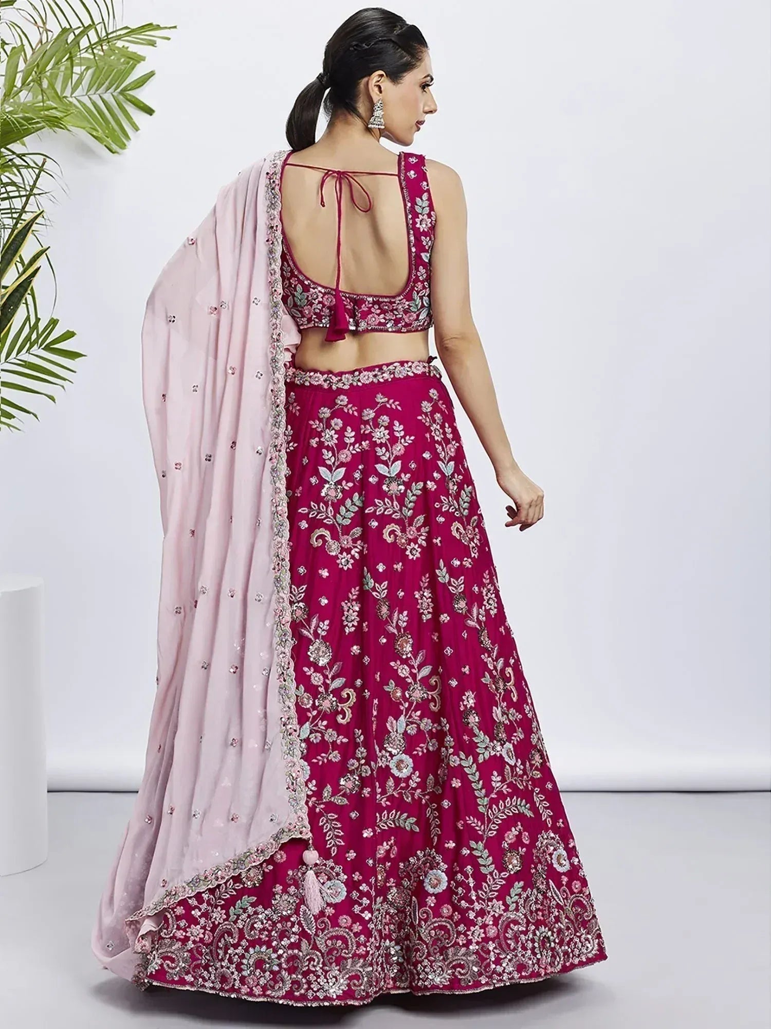 Elegant maroon lehenga choli with floral embroidery and pink dupatta, perfect for Indian ethnic occasions.
