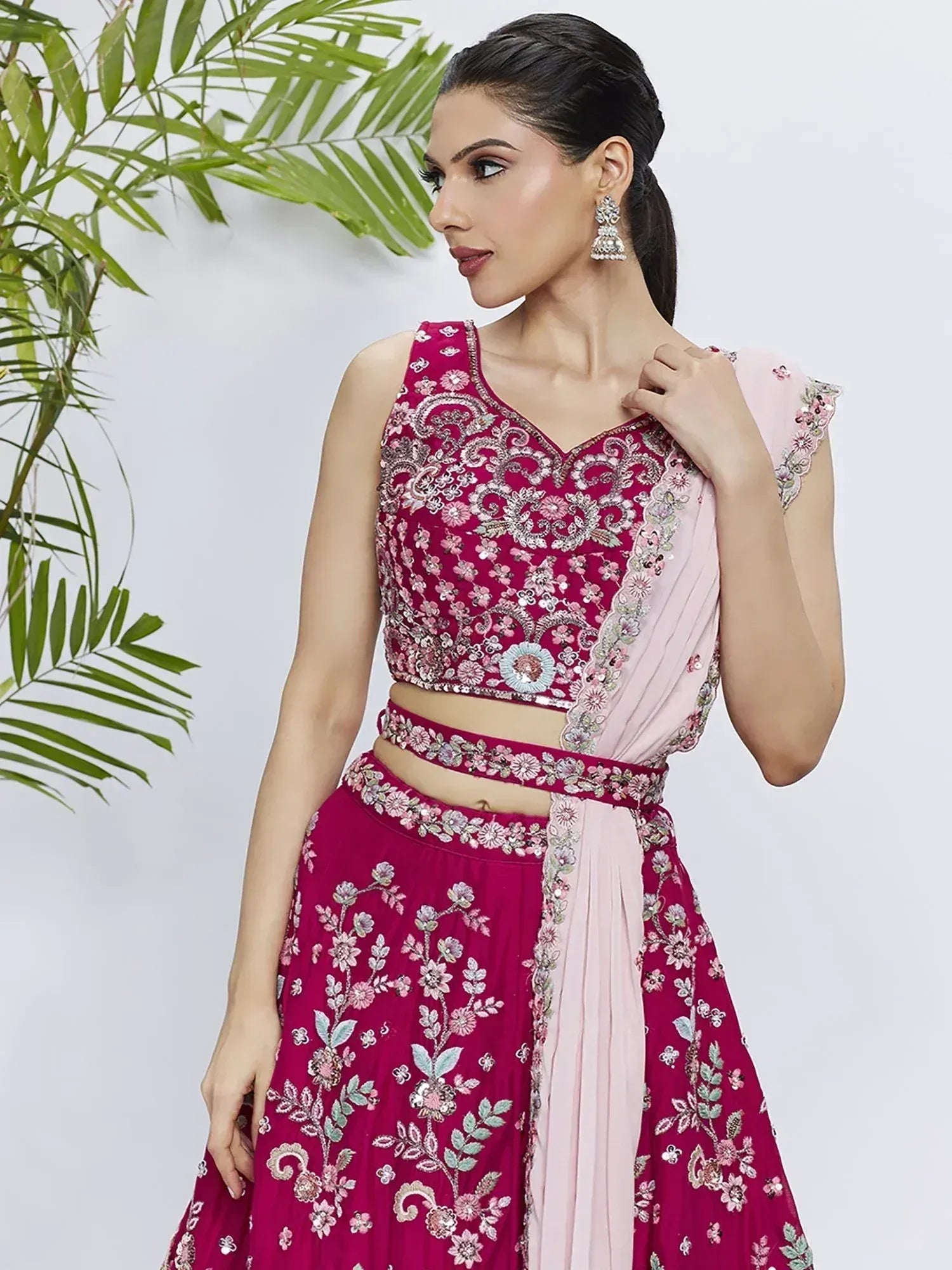 Elegant maroon lehenga choli with floral embroidery and pink dupatta, perfect for Indian ethnic occasions.
