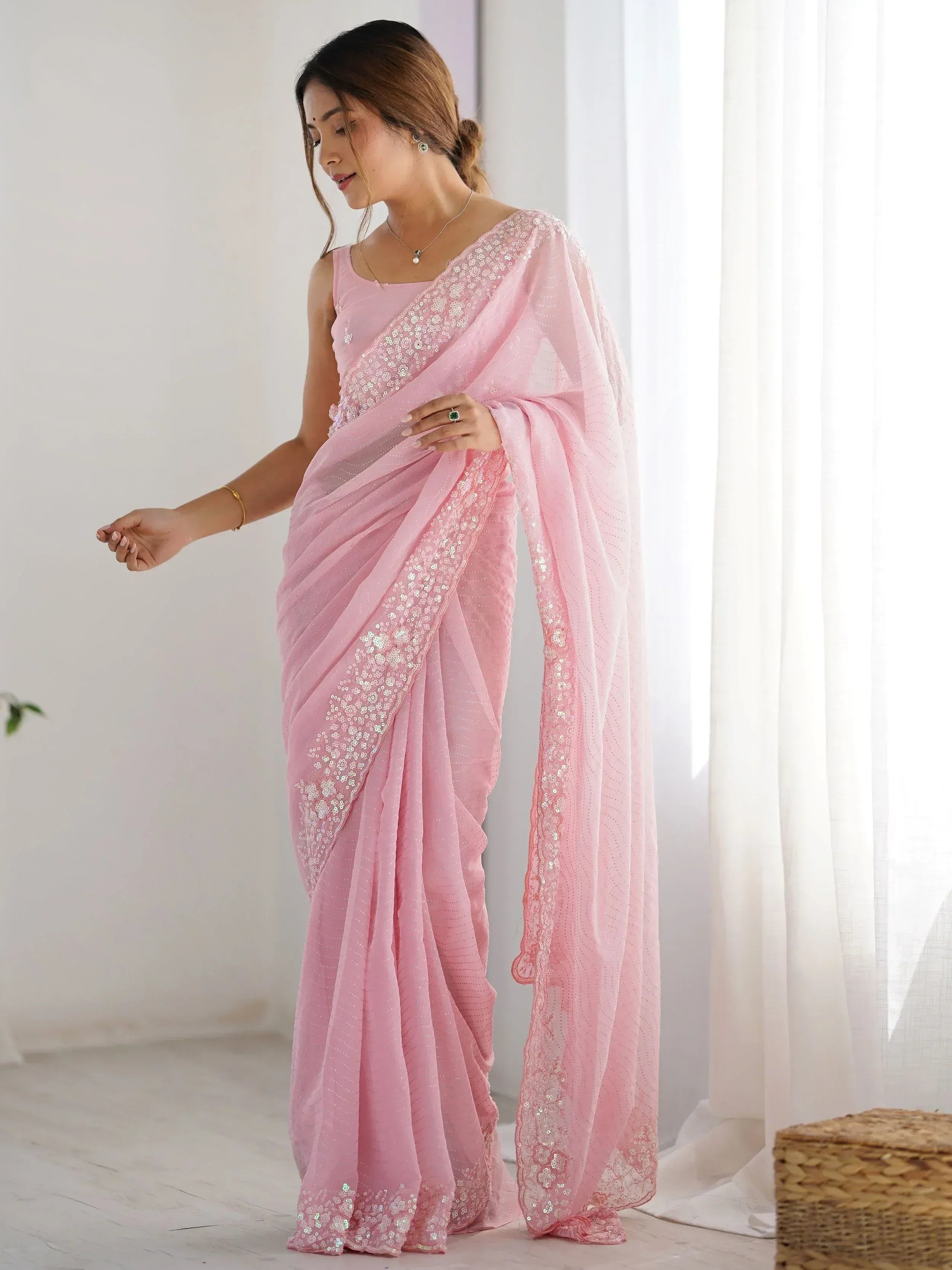 Pink sequin saree with floral embroidery, perfect for Indian ethnic wear and festive occasions.