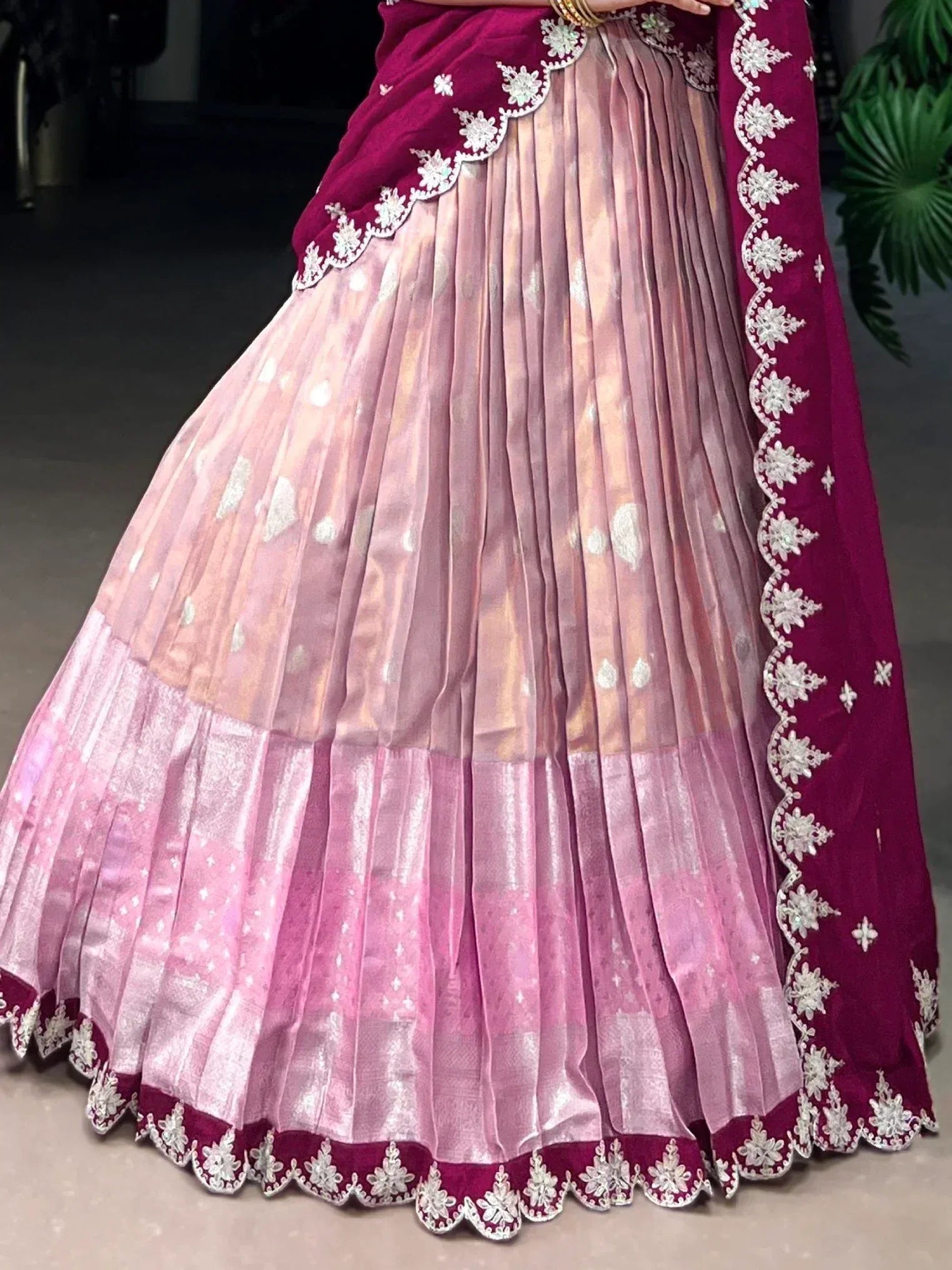 Pink and maroon designer lehenga with floral embroidery and pleated skirt, perfect for Indian ethnic wear.