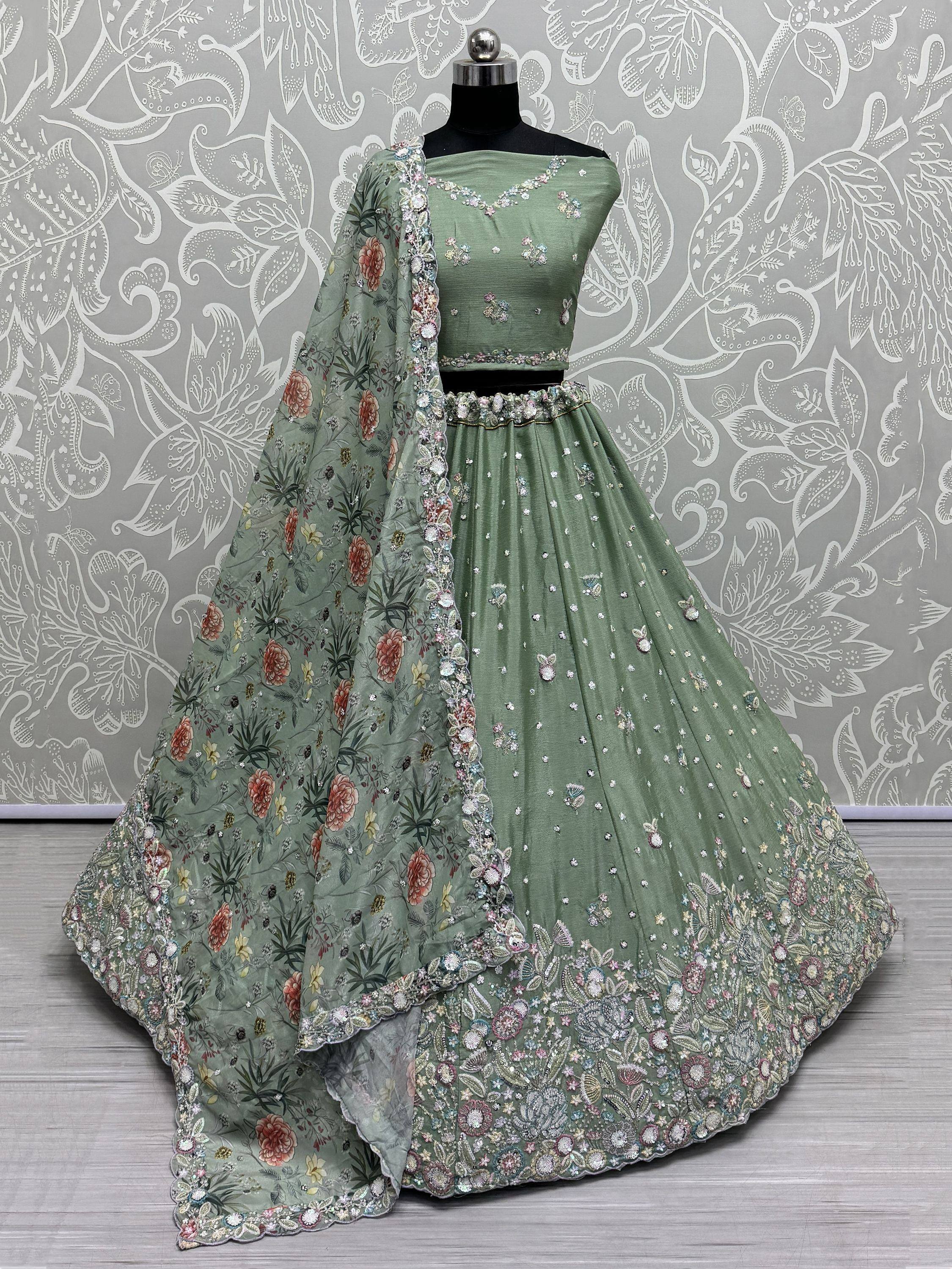 Mint green designer lehenga choli with floral dupatta, perfect for weddings and festive occasions.