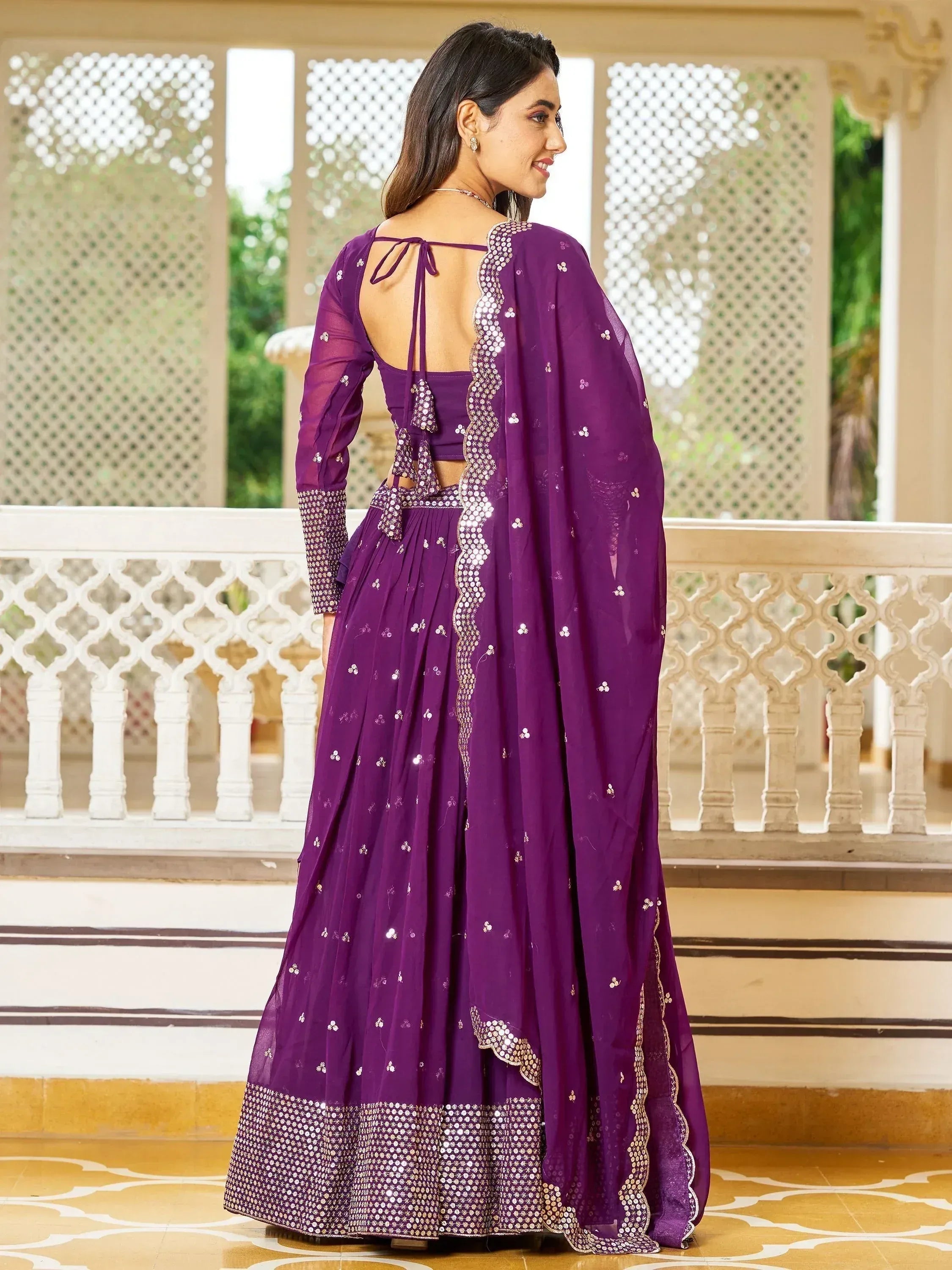 Purple designer lehenga choli with mirror work, back tie blouse, and sheer dupatta for Indian ethnic wear
