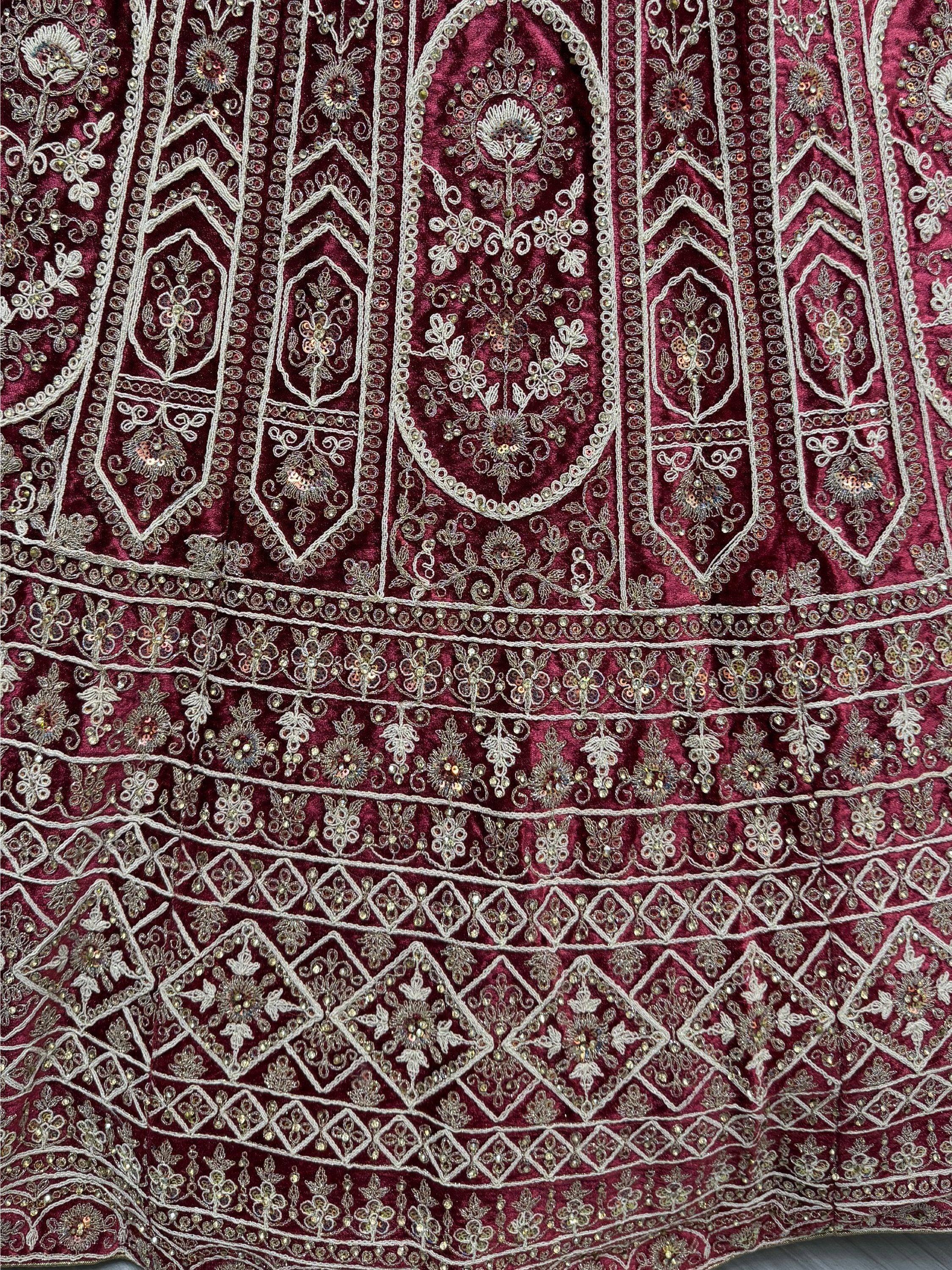 Rich maroon velvet with intricate silver embroidery and sequins, perfect for Indian ethnic wear like lehenga or saree.