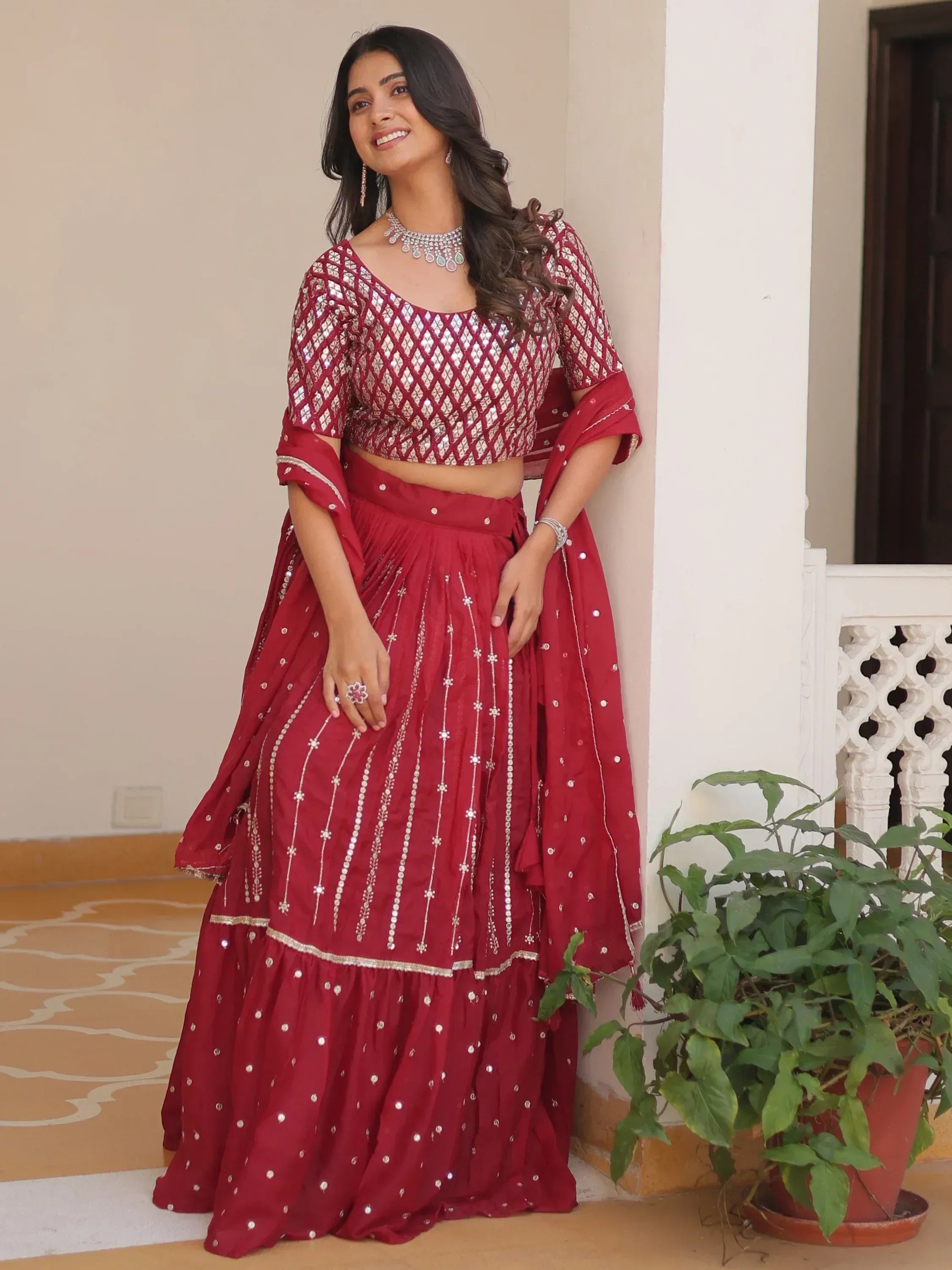 Red sequin lehenga choli with mirror work, perfect for Indian ethnic wear and festive occasions.