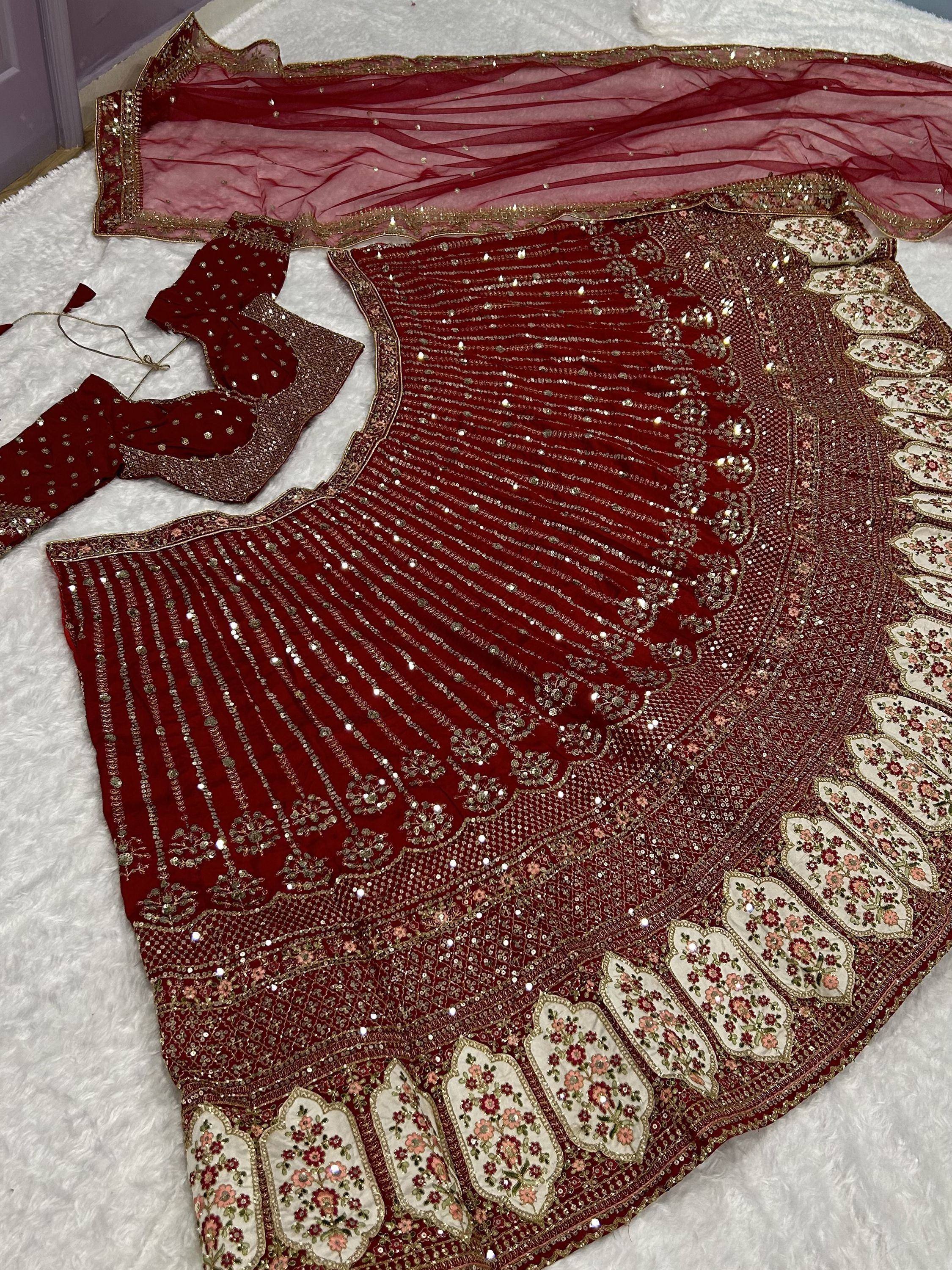 Red embroidered lehenga choli with gold sequins and floral border, Indian ethnic wear
