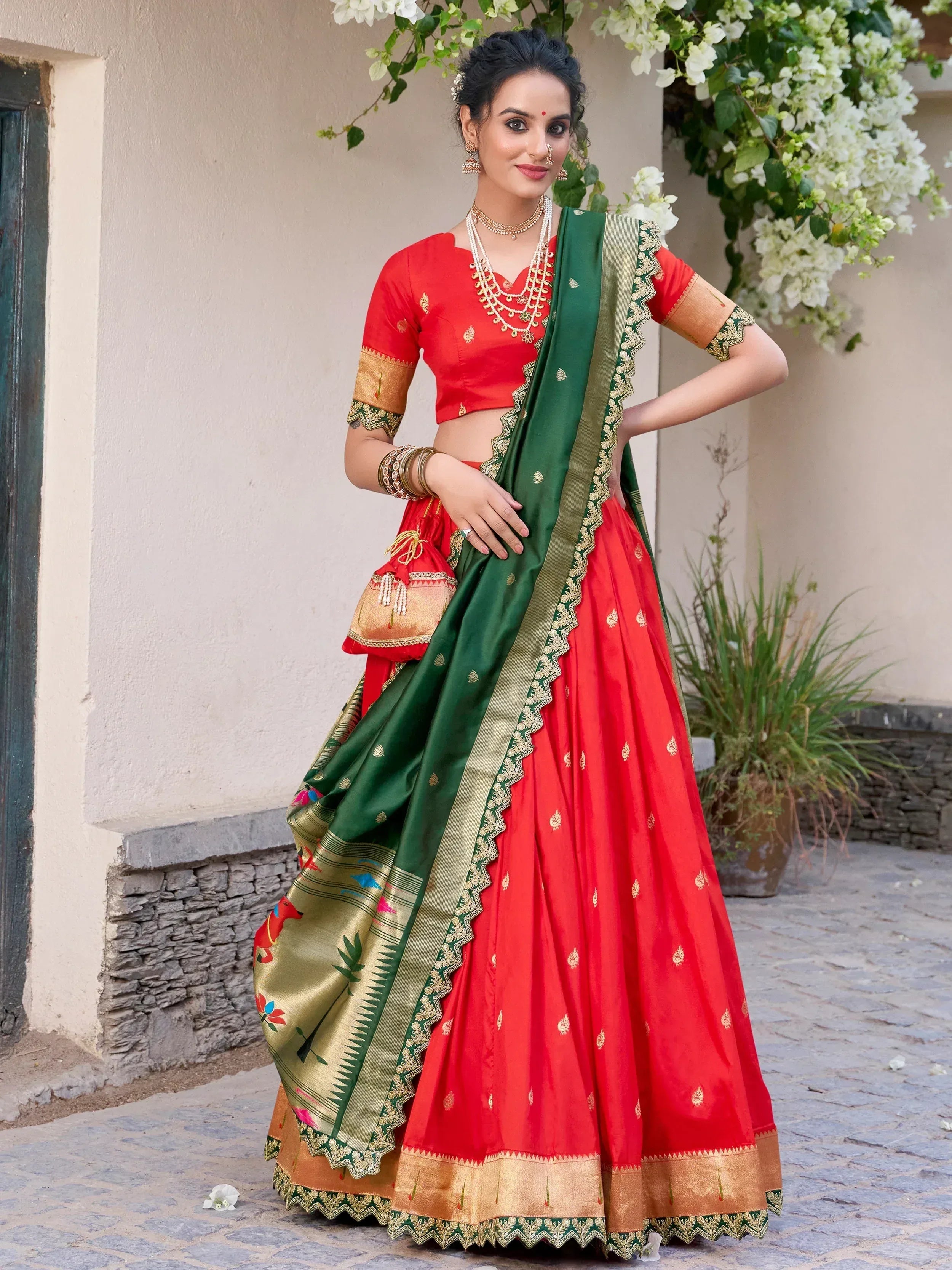 Red and green designer lehenga choli with gold embroidery, perfect for Indian ethnic wear occasions
