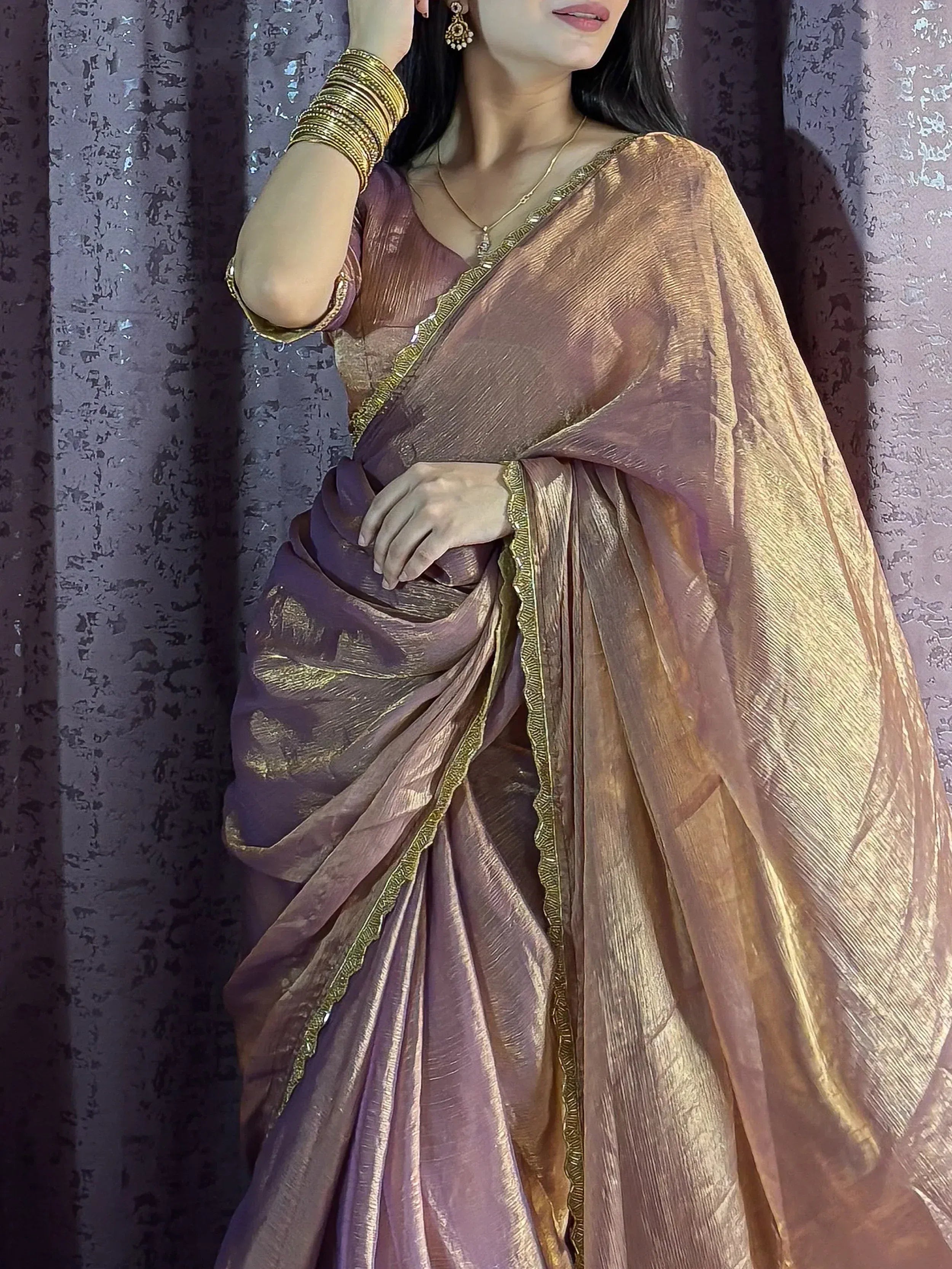 Elegant mauve saree with gold border, perfect for Indian ethnic wear and festive occasions.