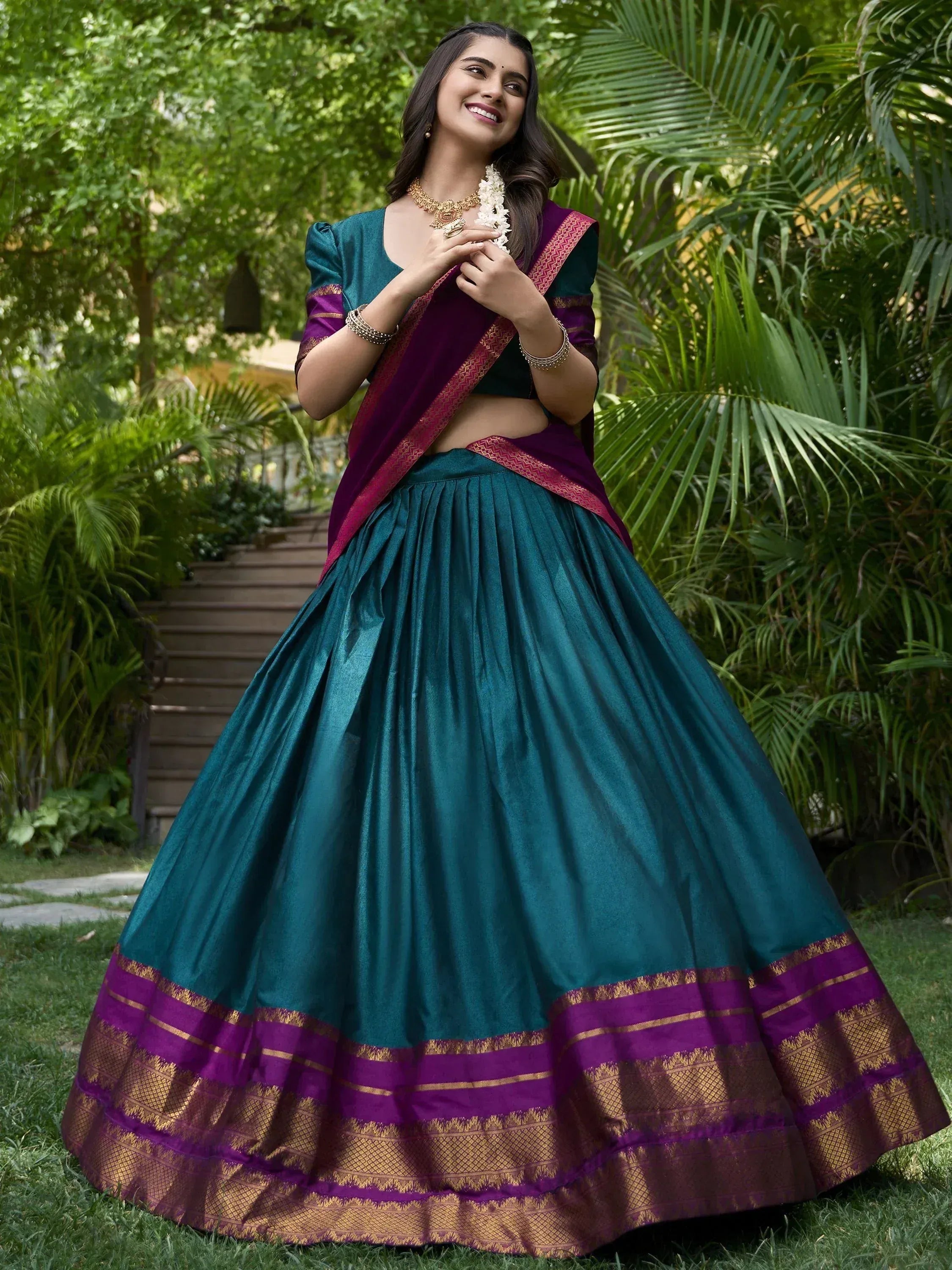 Teal and purple designer lehenga choli with gold border, perfect for Indian ethnic wear occasions
