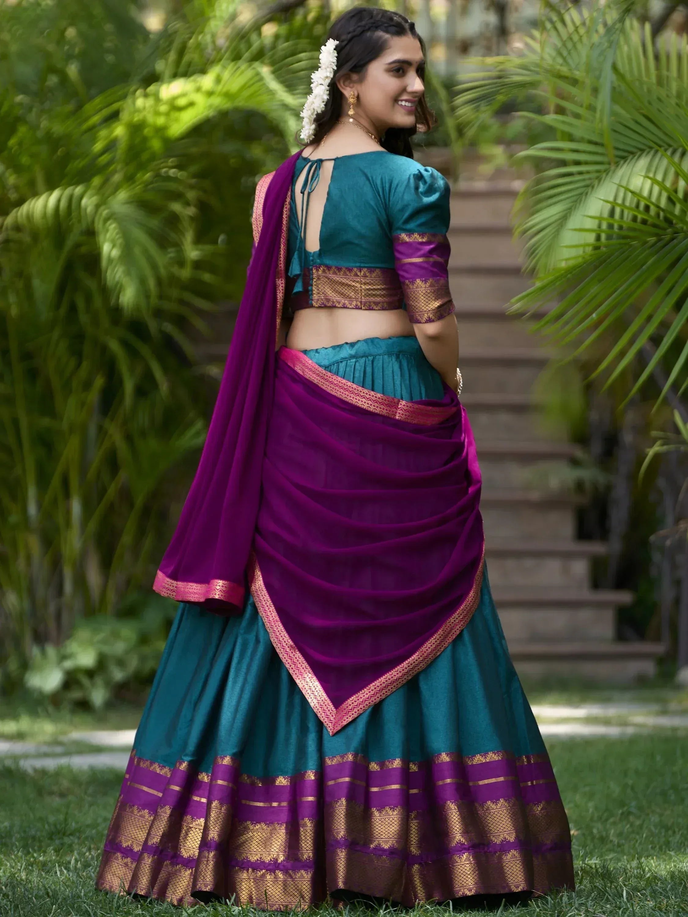 Teal and purple designer lehenga choli with gold border, perfect for Indian ethnic wear occasions