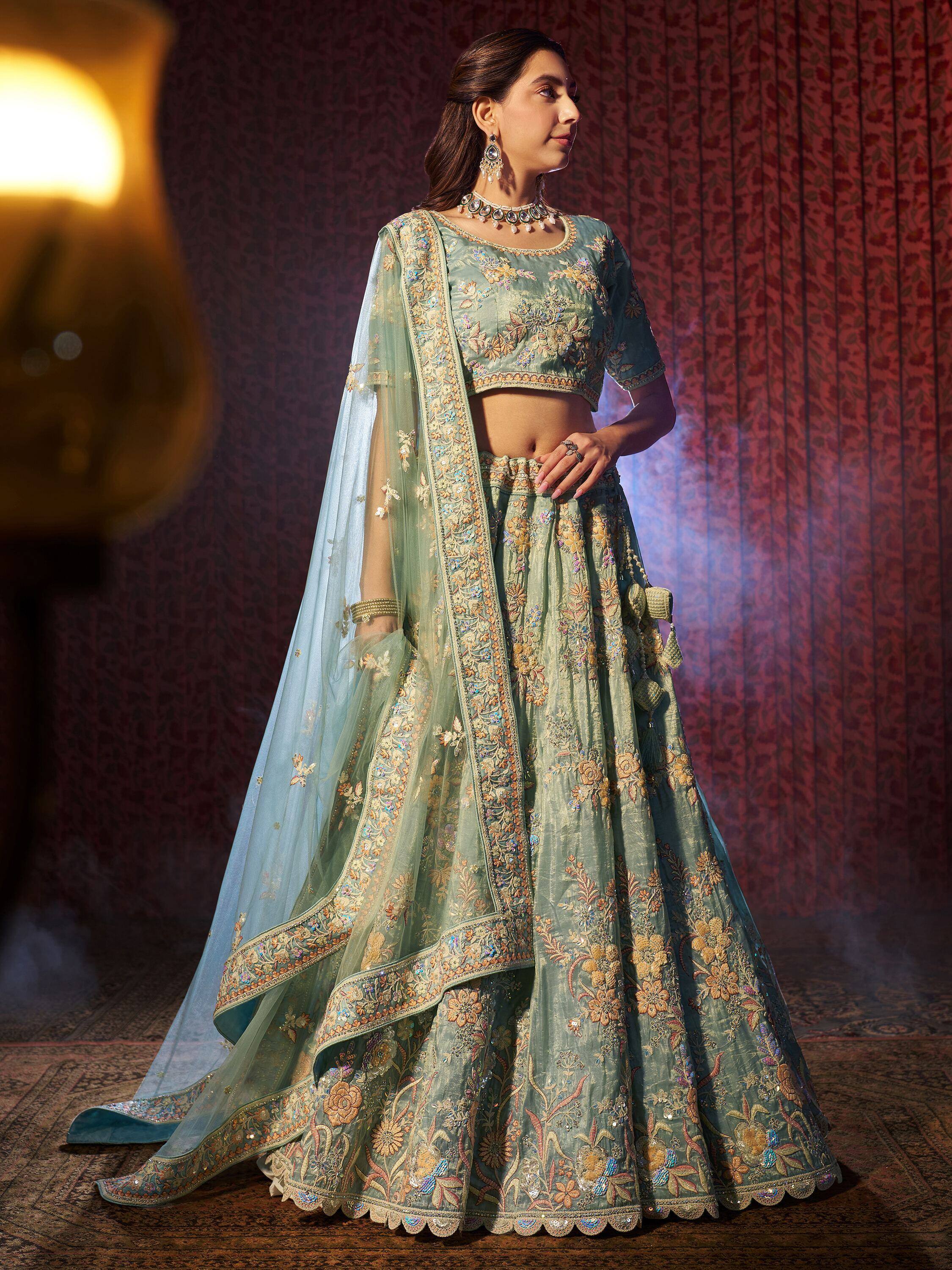 Elegant mint green embroidered lehenga choli with floral motifs and sheer dupatta for Indian ethnic wear