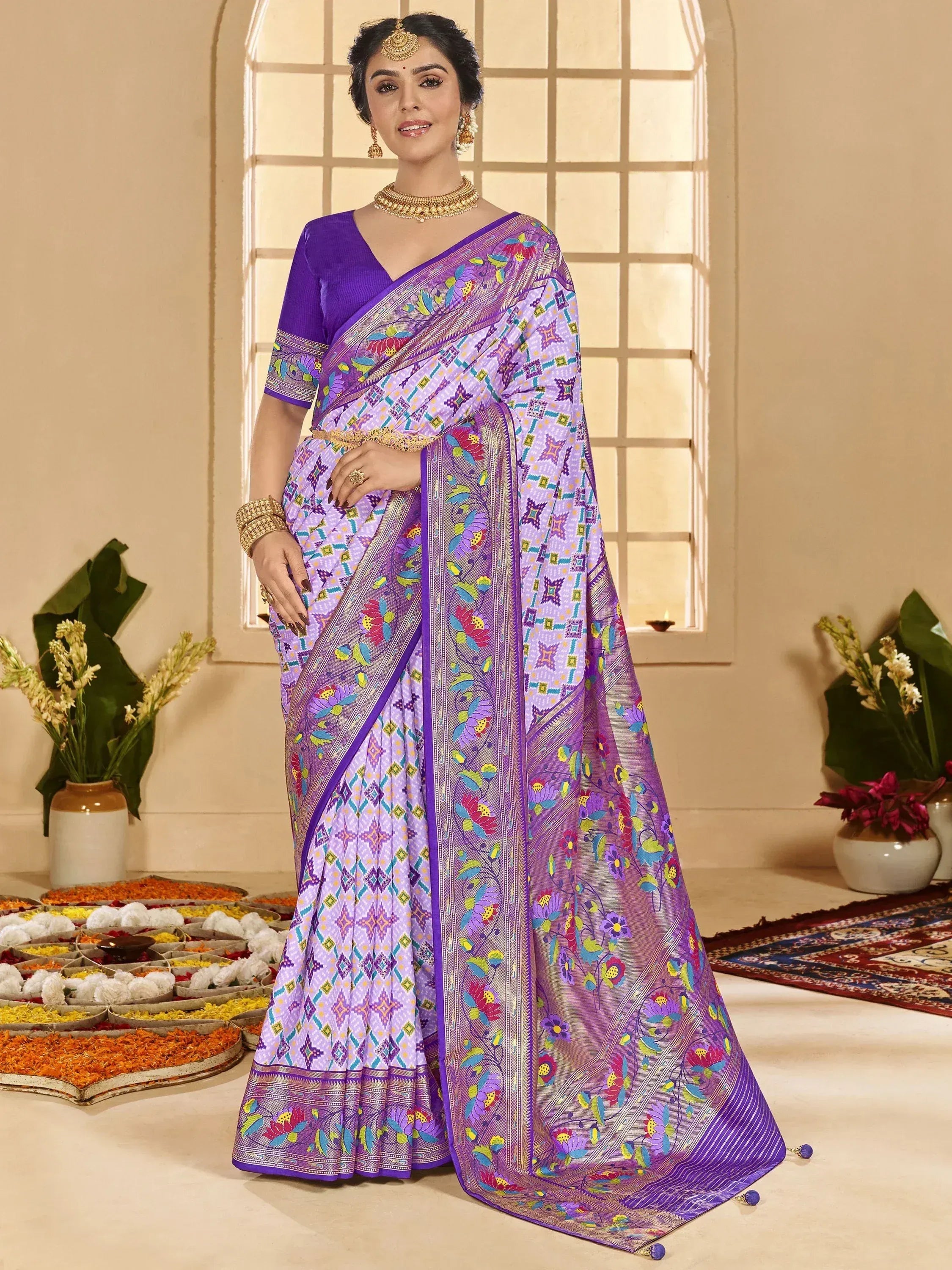 Purple floral printed saree with geometric border, paired with matching blouse, ideal for Indian ethnic occasions