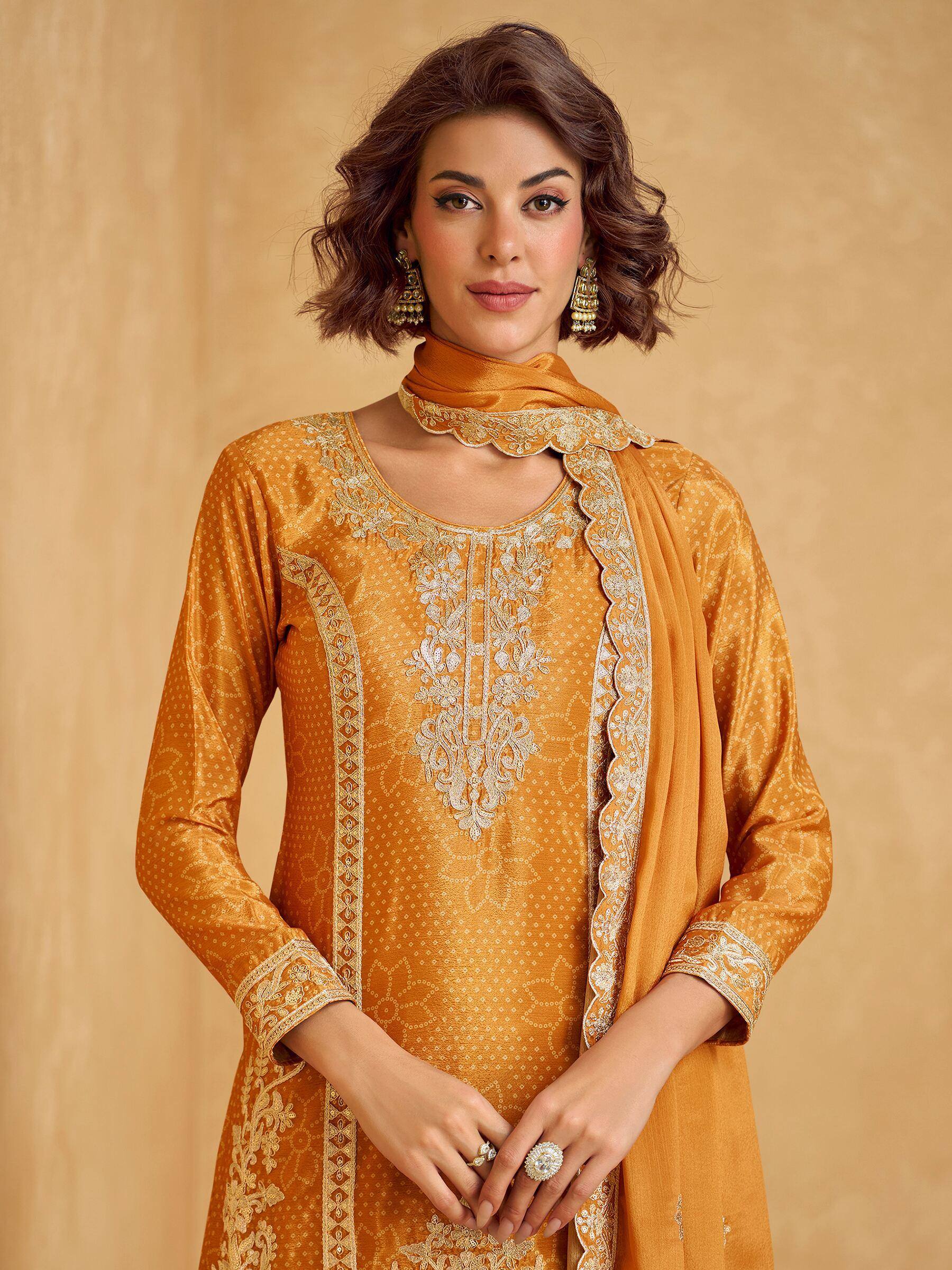 Mustard yellow embroidered salwar kameez with scalloped dupatta, perfect for Indian ethnic wear occasions