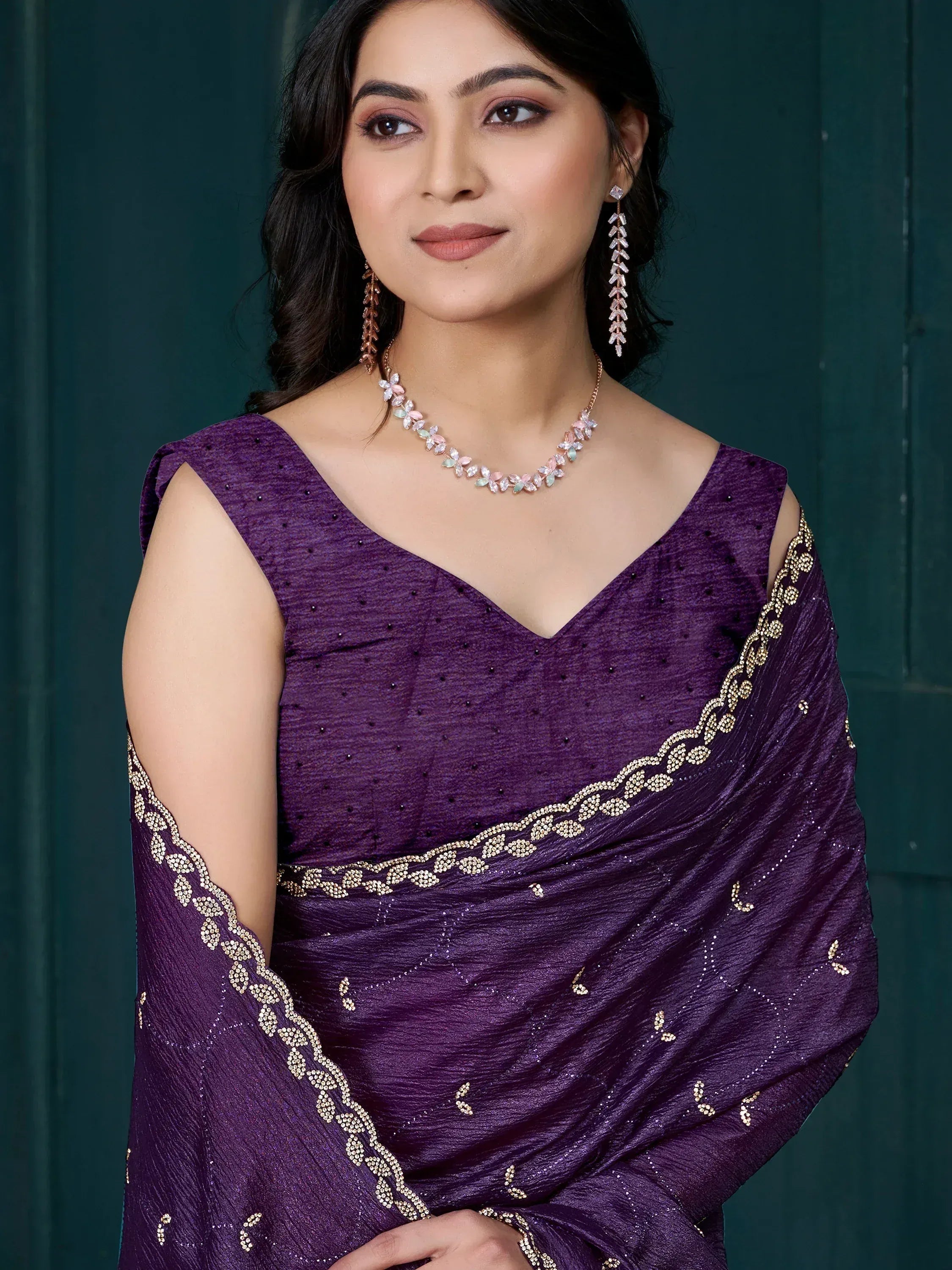 Elegant purple saree with gold embroidery and embellished border, perfect for Indian ethnic occasions.