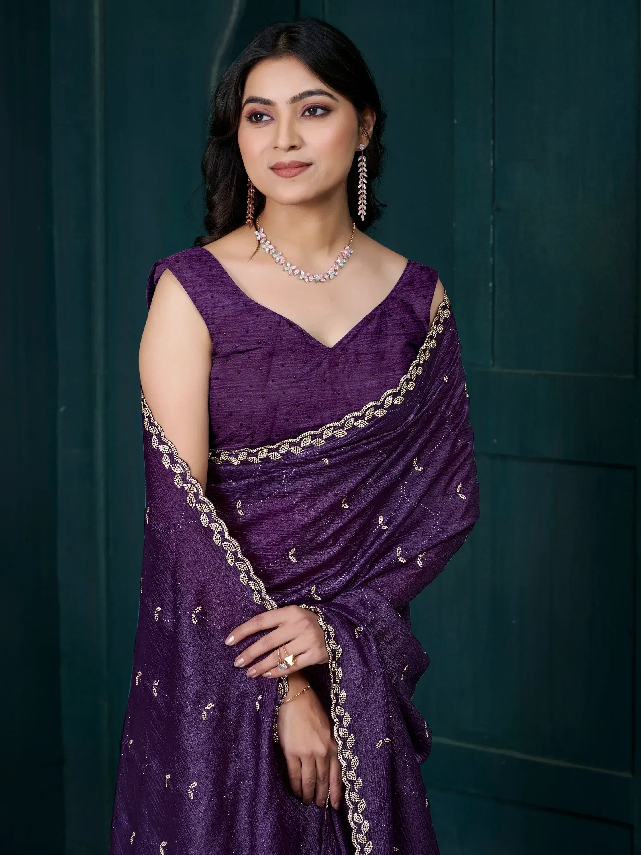 Elegant purple saree with gold embroidery, perfect for Indian ethnic occasions and festive wear.