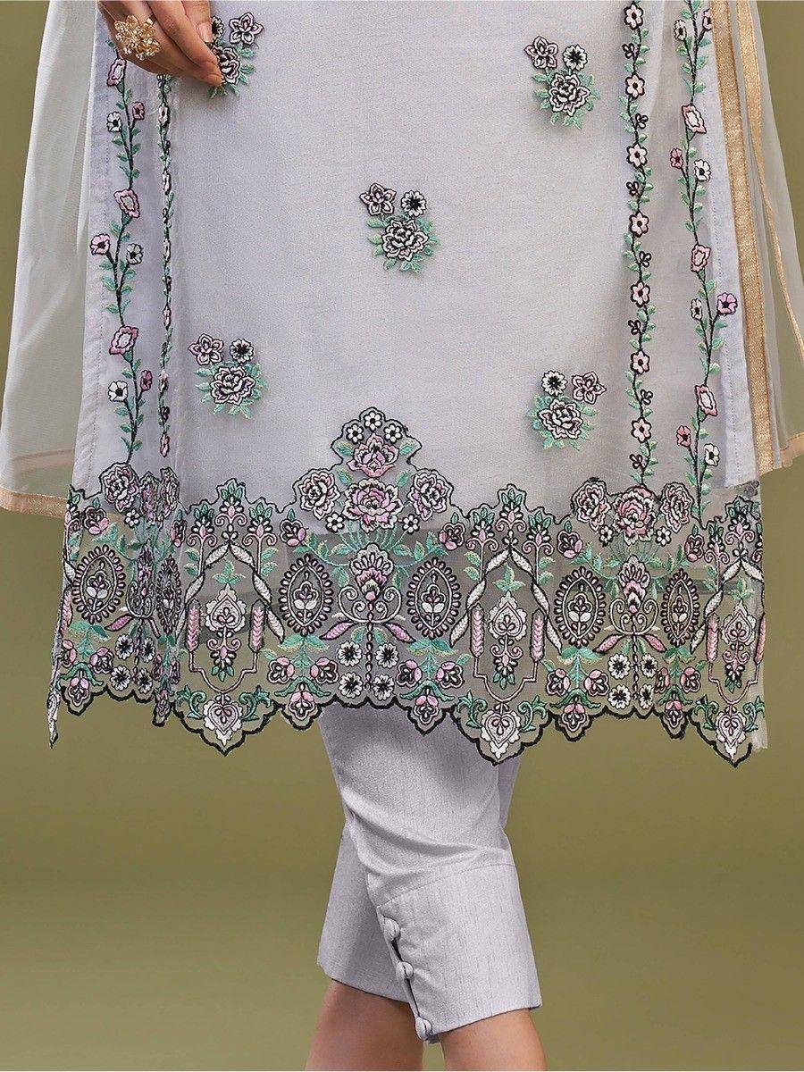 Light grey embroidered salwar kameez with floral lace hem and matching pants, ideal for ethnic wear occasions