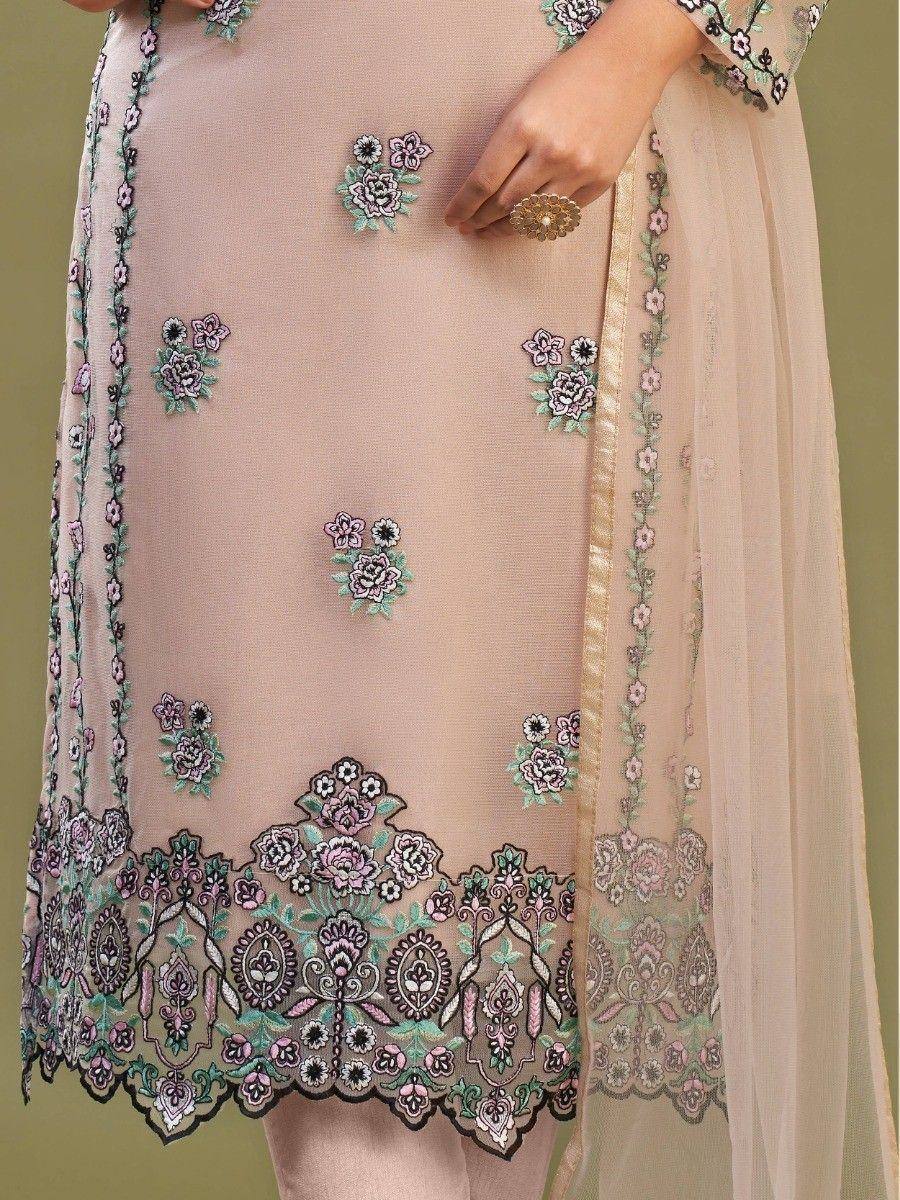 Pink embroidered salwar kameez with floral motifs and lace detailing, perfect for ethnic wear