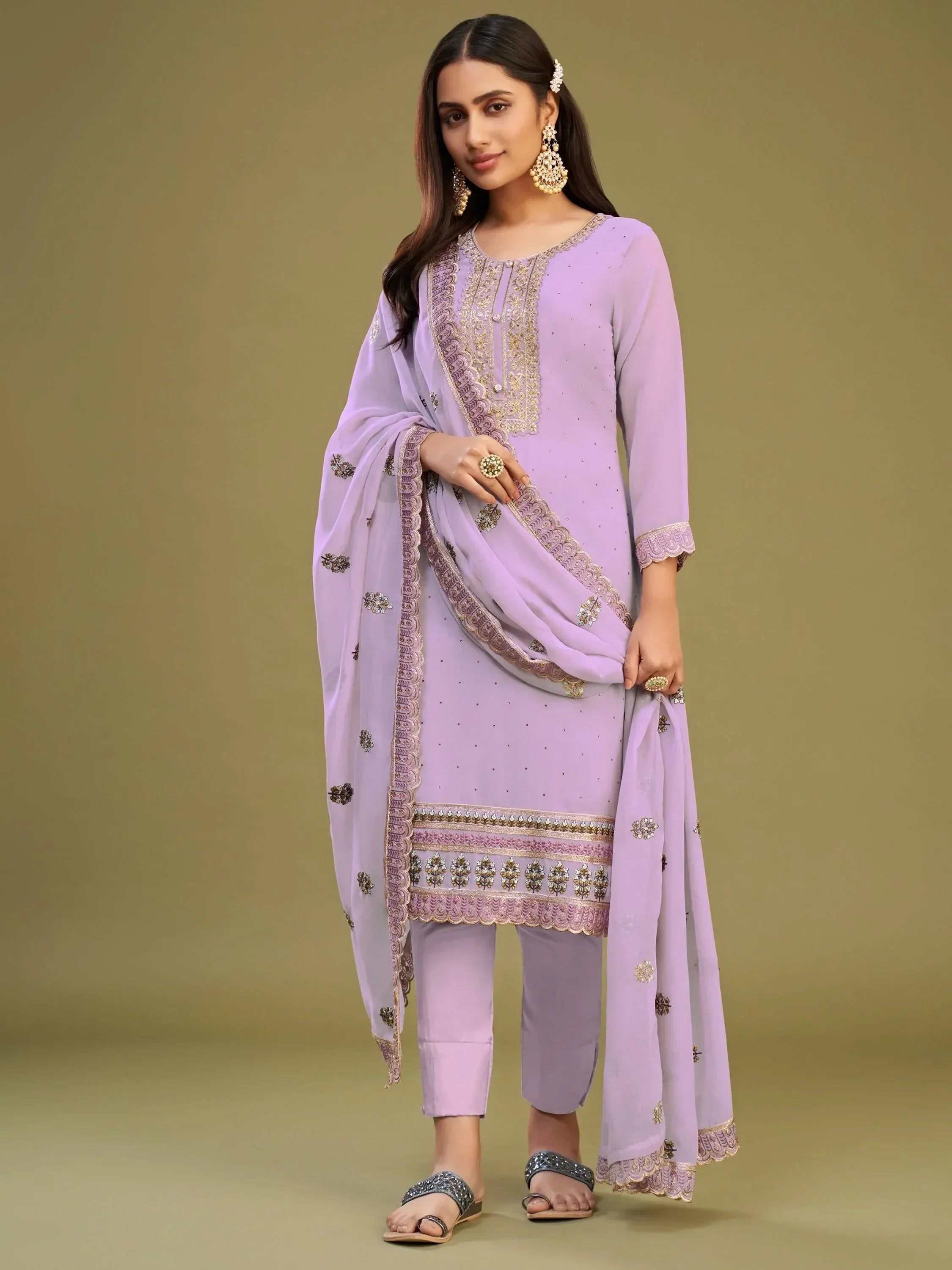 Lavender embroidered salwar kameez with gold detailing, perfect for Indian ethnic wear occasions.