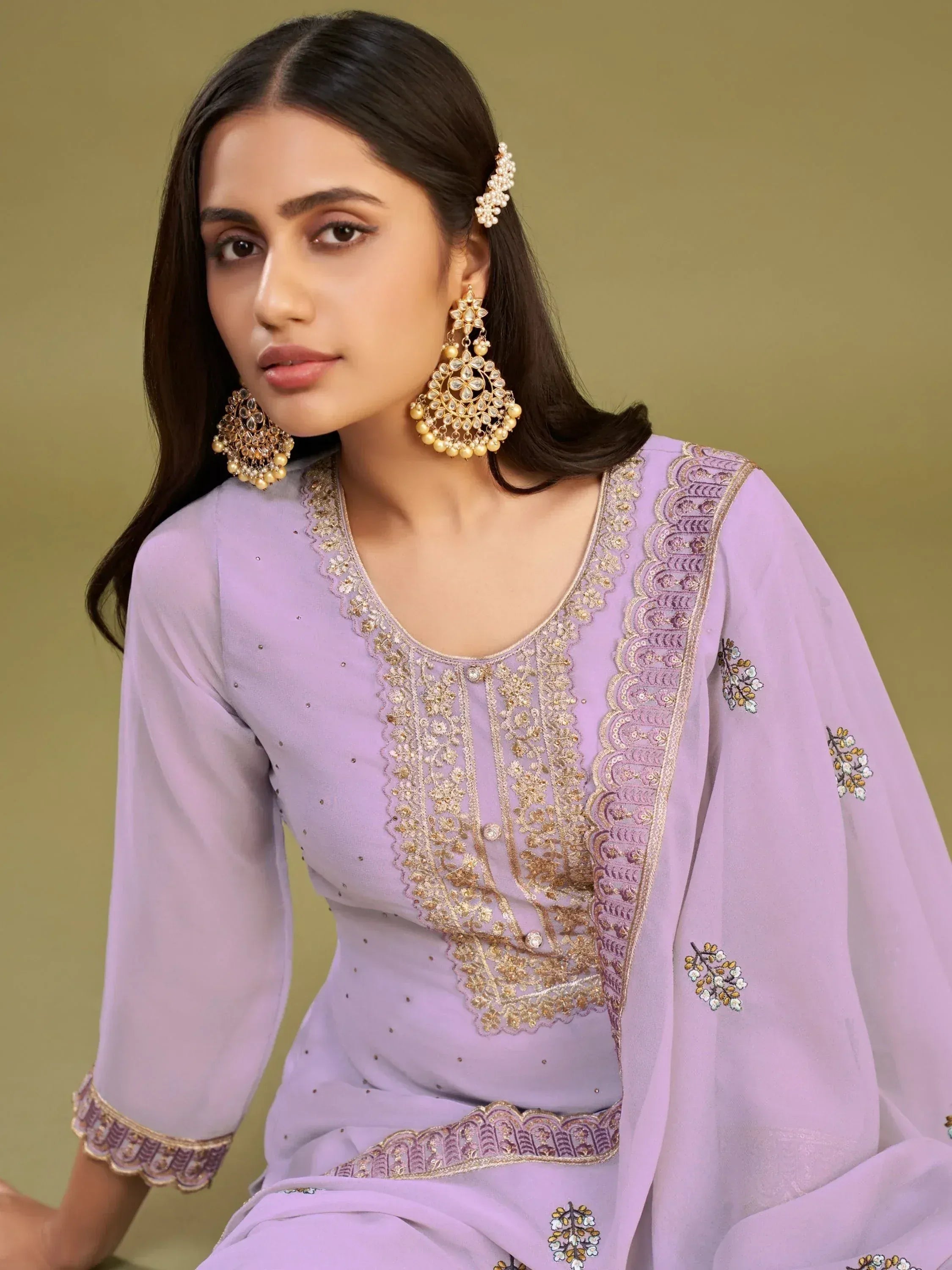 Lavender ethnic salwar kameez with gold embroidery and matching jewelry for Indian wear