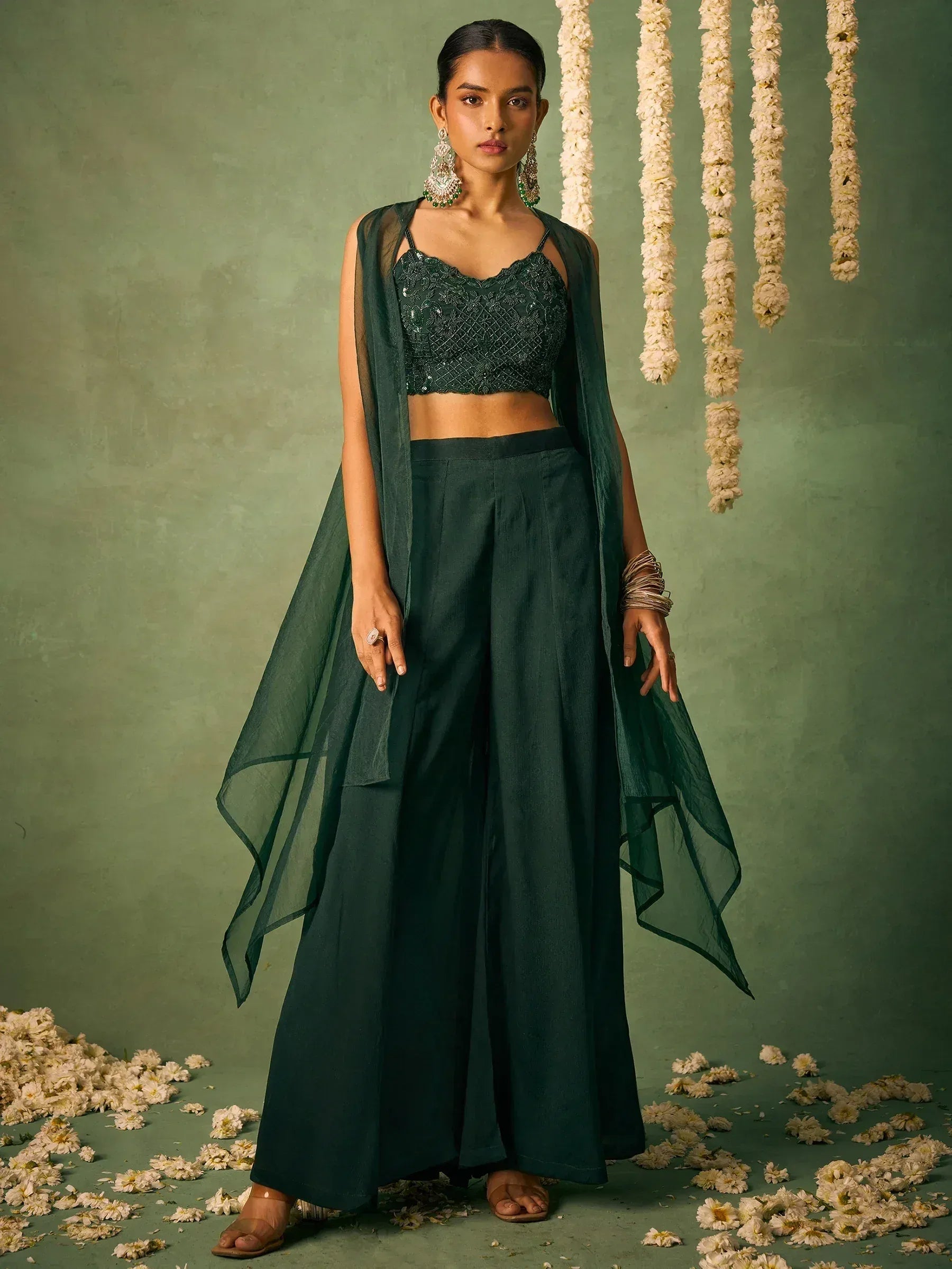 Emerald green ethnic palazzo set with sequin crop top and sheer dupatta, perfect for Indian occasions