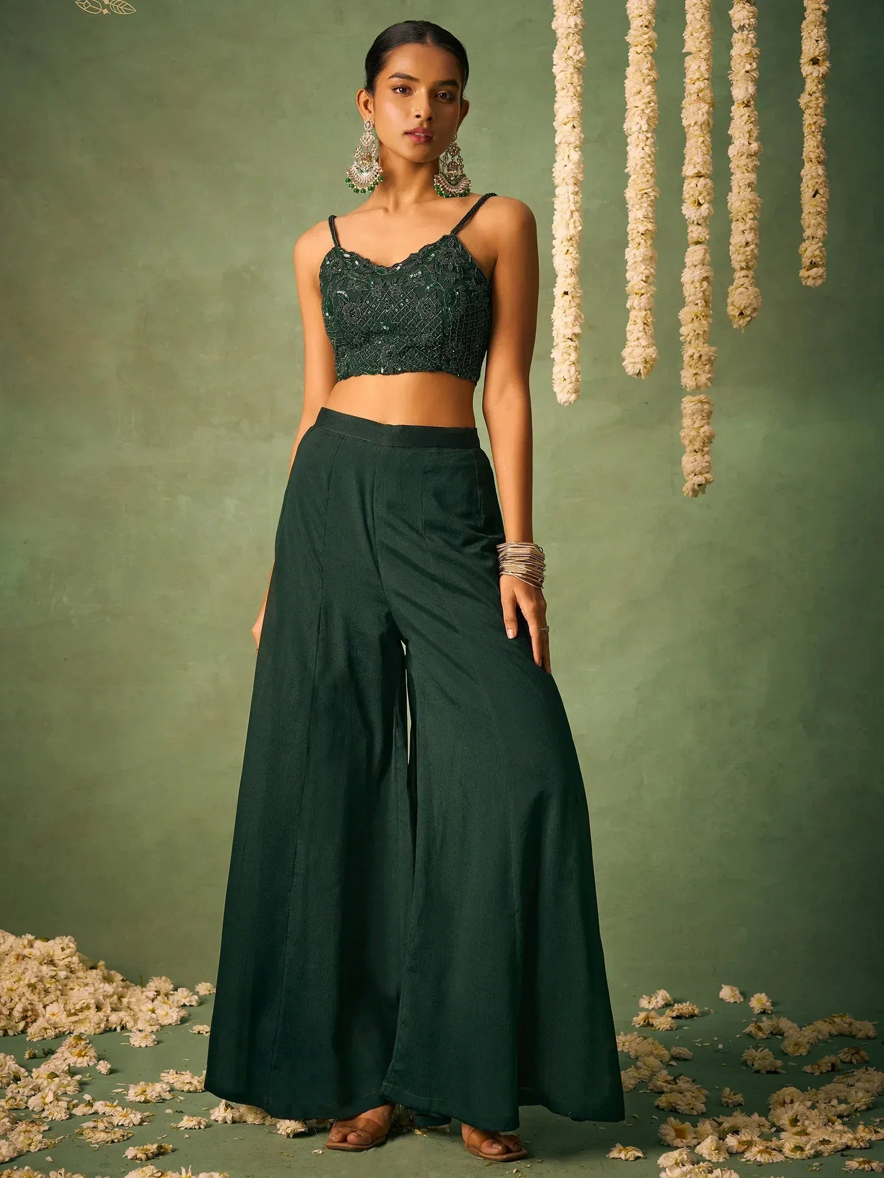 Emerald green ethnic palazzo set with sequin crop top, perfect for Indian occasions and festive wear.