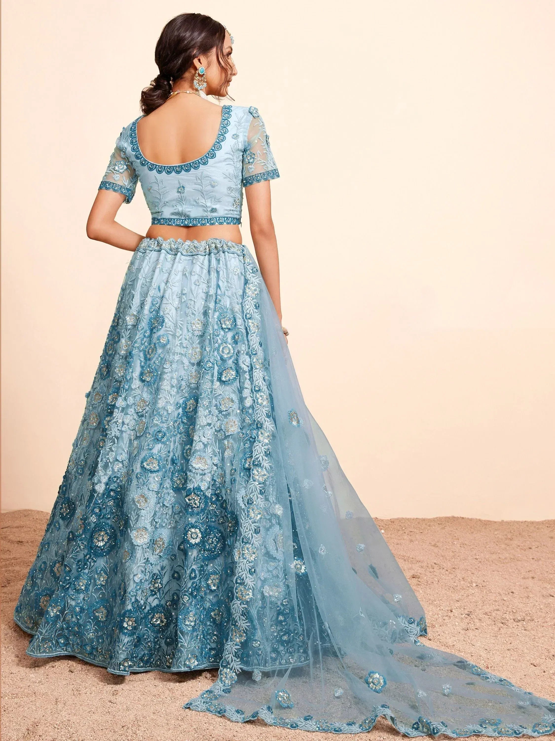 Light blue embroidered lehenga choli with floral detailing and sheer dupatta, perfect for Indian ethnic wear occasions.