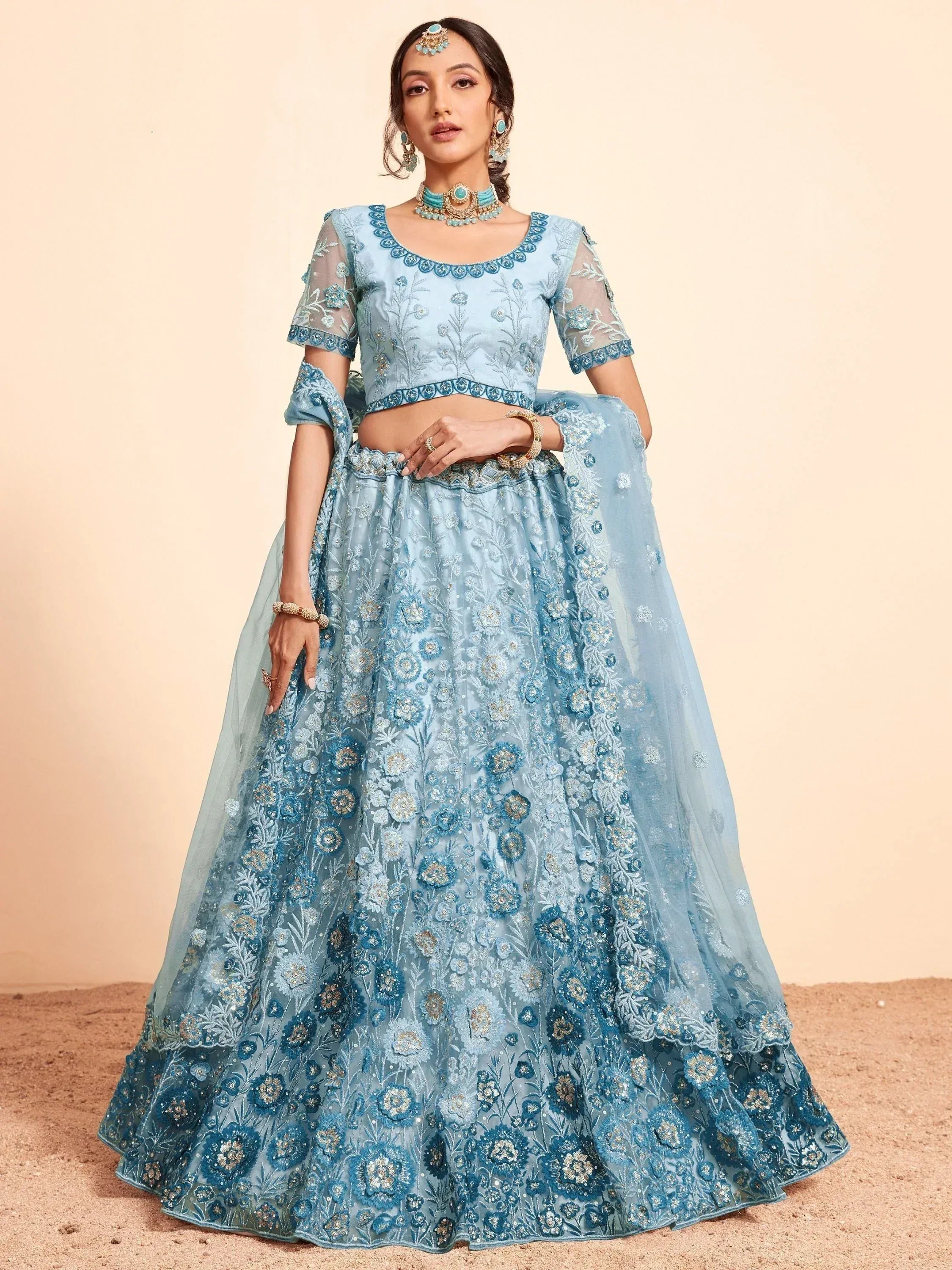 Light blue embroidered lehenga choli with floral detailing, perfect for Indian ethnic wear events.