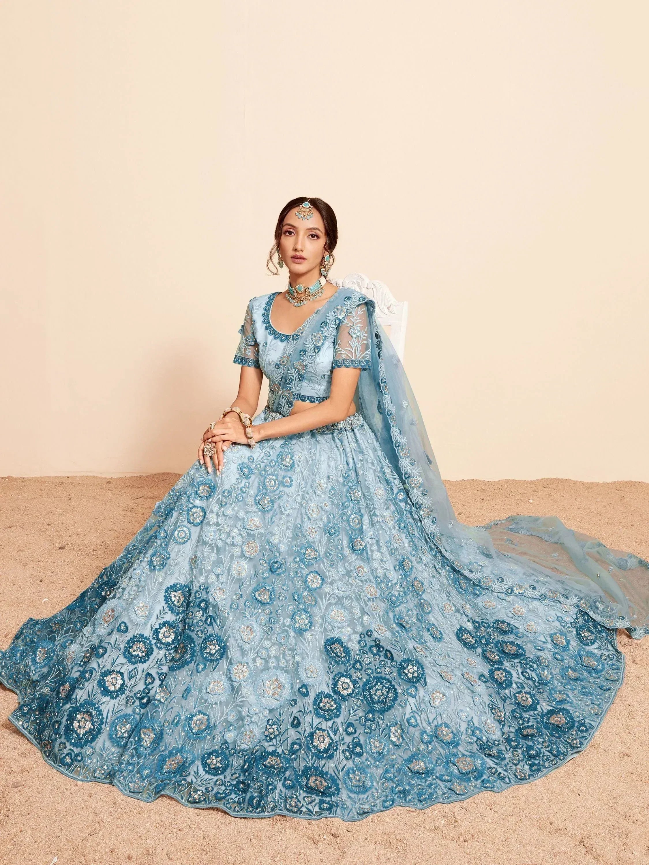 Blue floral embroidered lehenga choli with sheer dupatta, perfect for Indian weddings and festive occasions