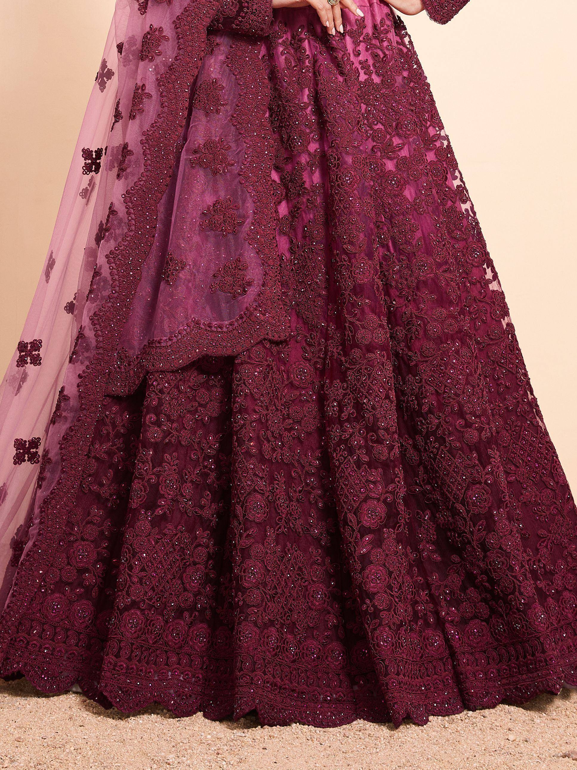 Burgundy embroidered lehenga choli with floral lace and sheer dupatta, perfect for Indian weddings and festive occasions.