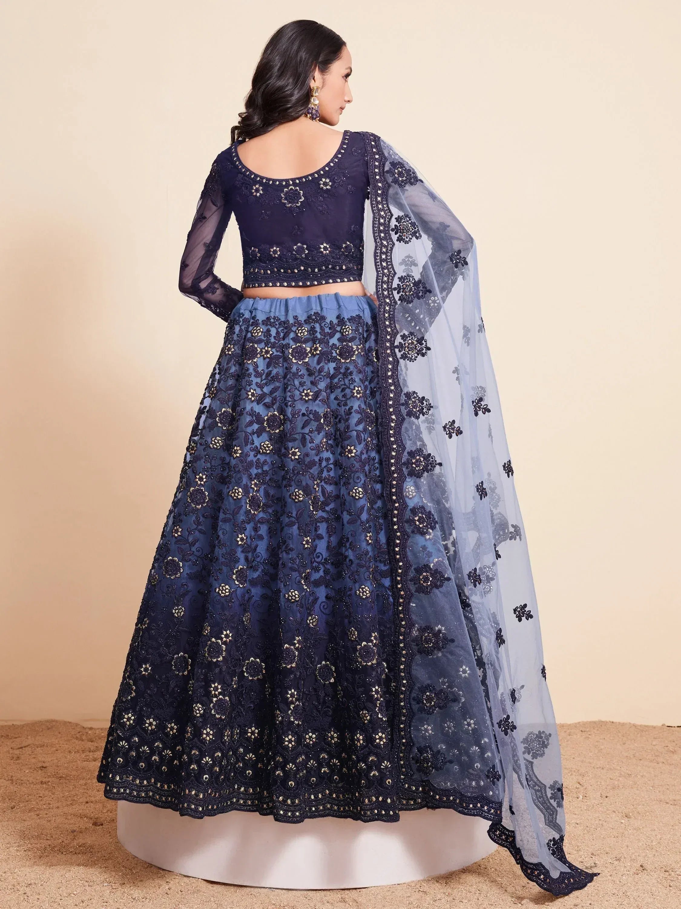Navy blue embroidered lehenga choli with sheer dupatta, perfect for Indian ethnic wear occasions.