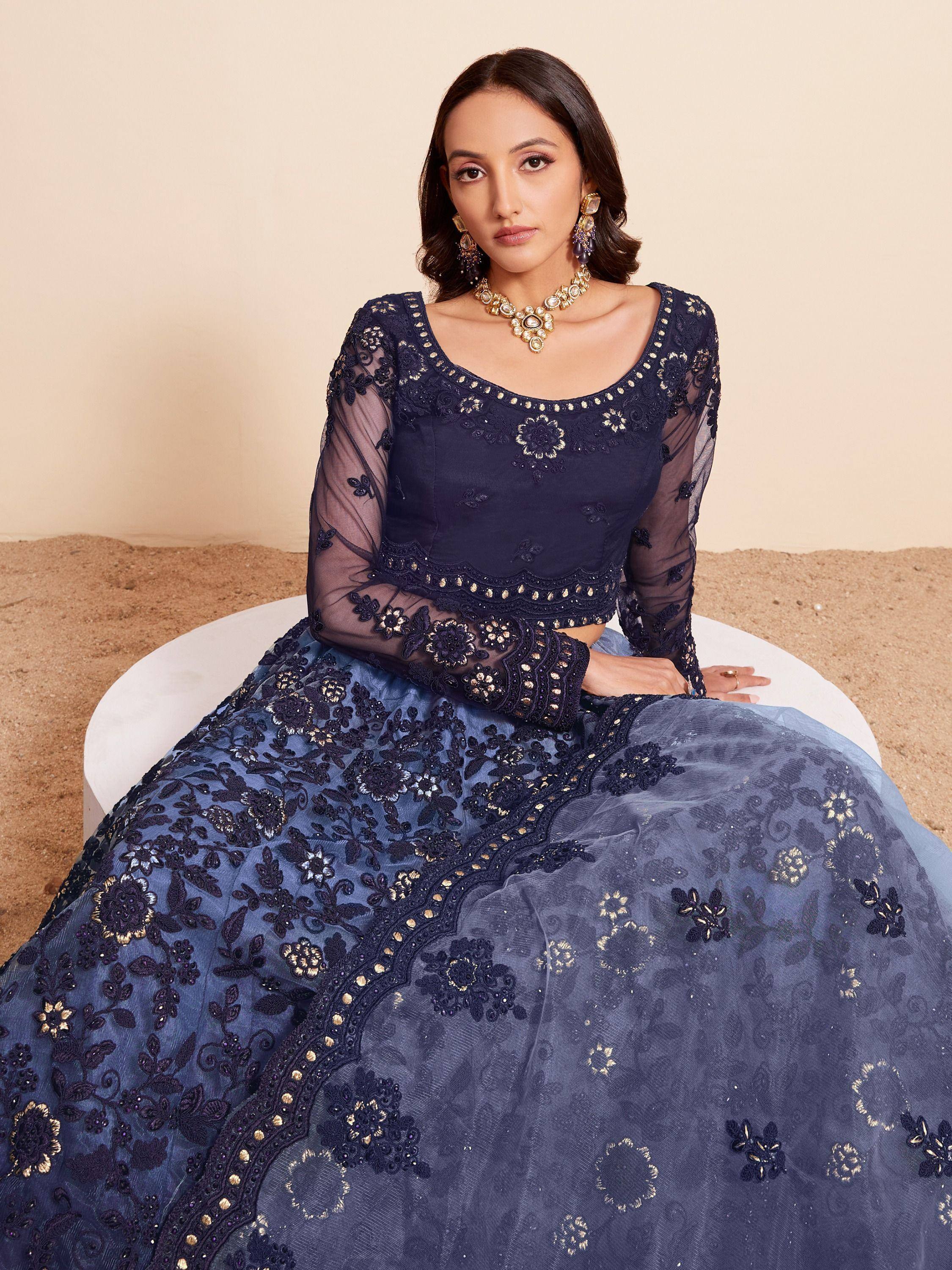 Navy blue embroidered lehenga choli with sheer sleeves, perfect for Indian ethnic wear events