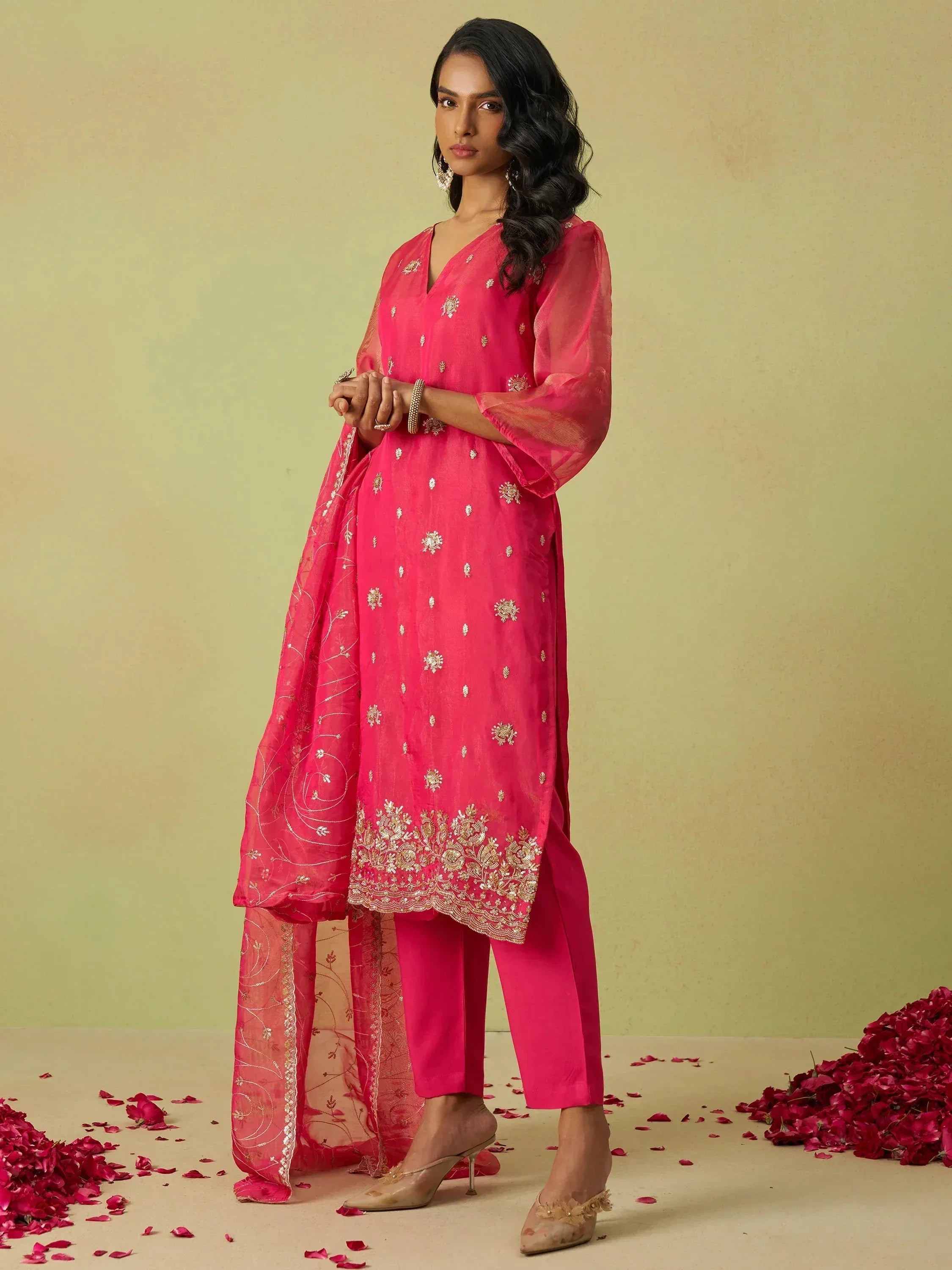 Pink embroidered salwar kameez with sheer dupatta, floral embellishments, and matching pants for ethnic wear